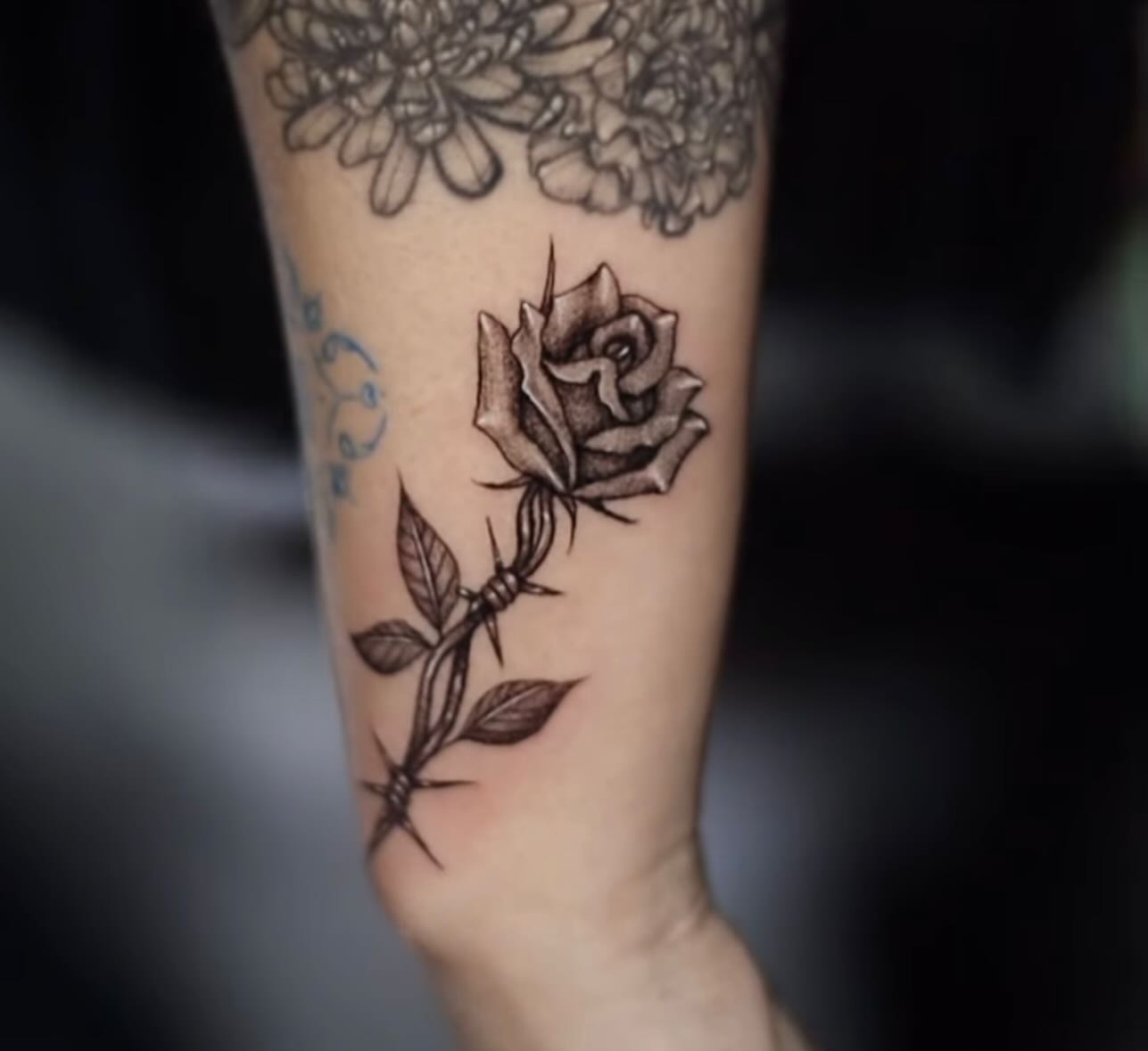 Rose black and grey tattoo on the forearm by 𝐒𝐡𝐞𝐫𝐥𝐥𝐲