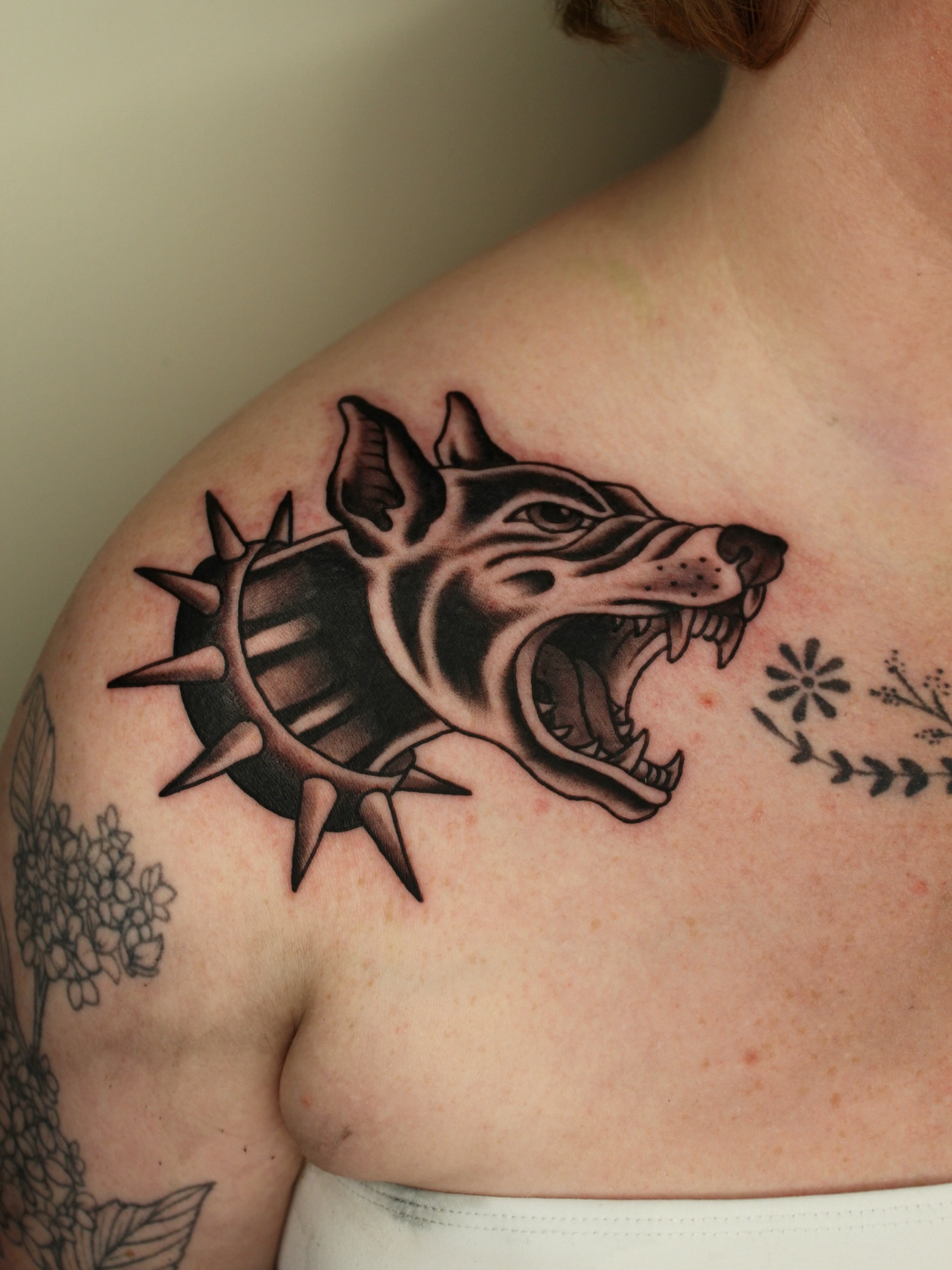 Pig head with thorns black and grey tattoo on the shoulder by Kehrmie Tattoos, Berkeley, California