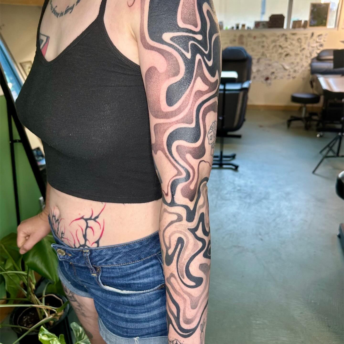 Abstract wave pattern black and grey tattoo on the forearm by 𝔠𝔞𝔯𝔯𝔦𝔢