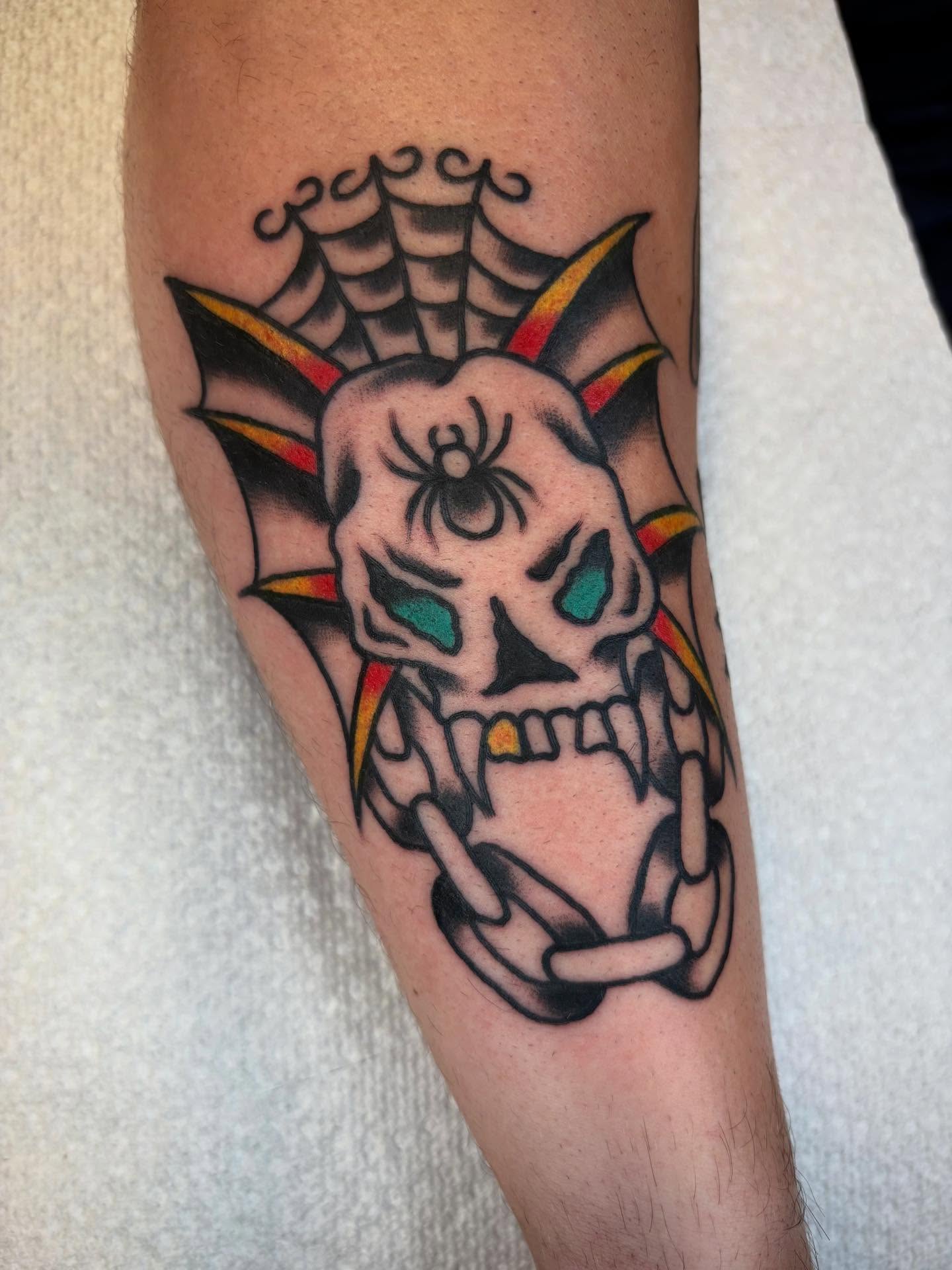 Skull with spider American traditional tattoo on the forearm by 🌹