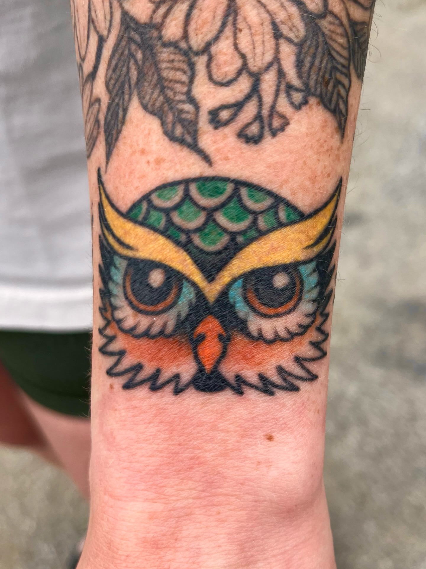 Owl American traditional tattoo on the forearm by Macy Bird