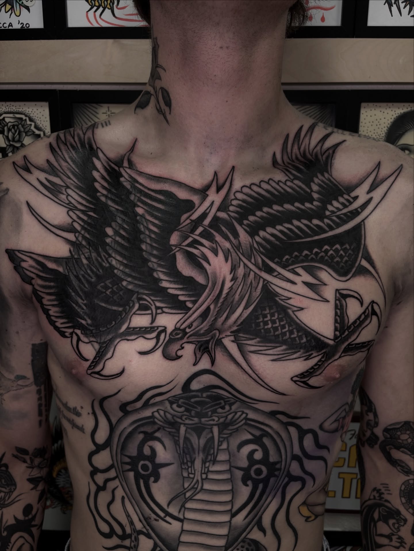 Phoenix and snake American traditional tattoo on the chest by Dallas Tattoo Artist