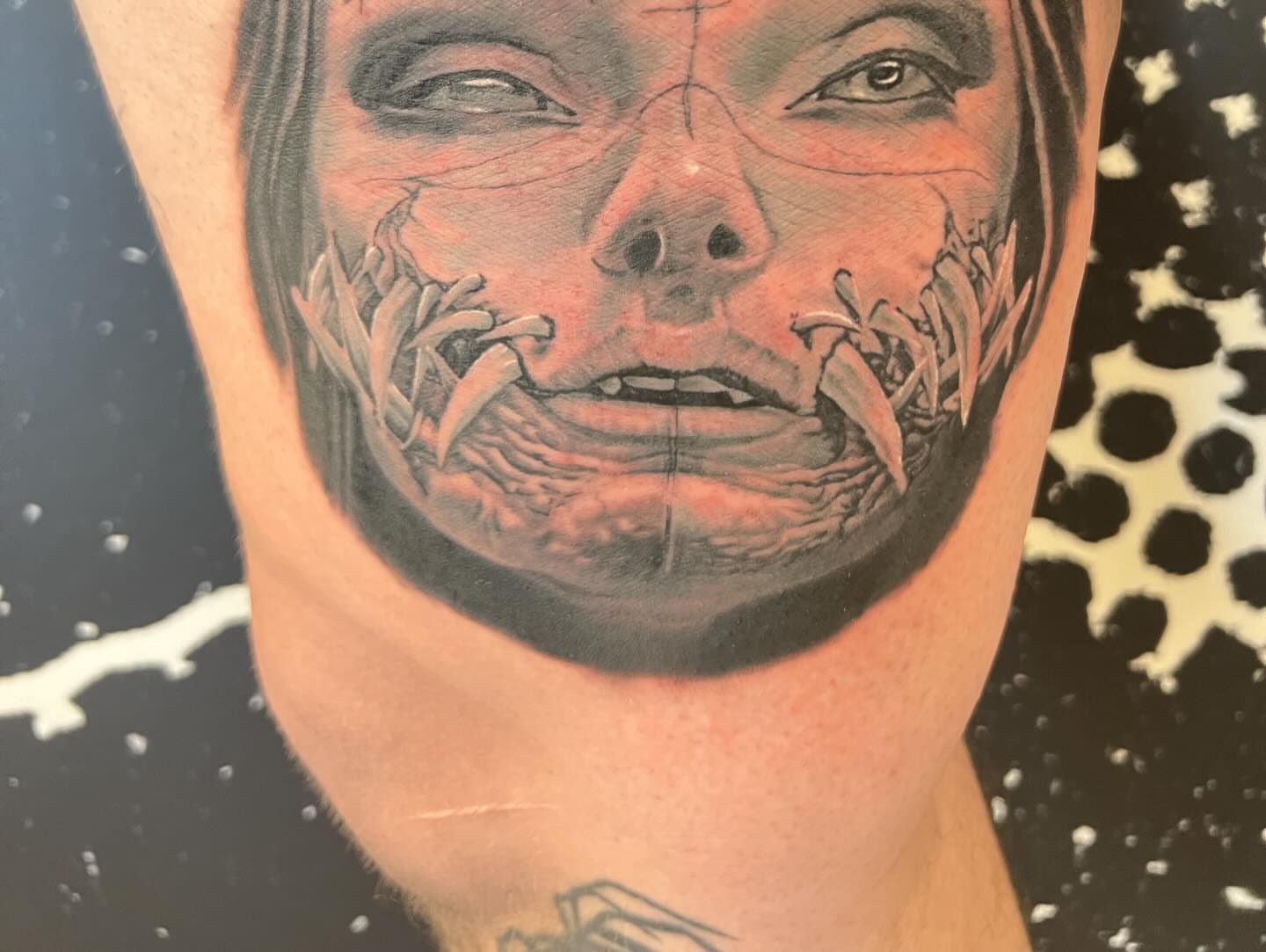 Scary face dark realism tattoo on the neck by Lord Daniel Serna