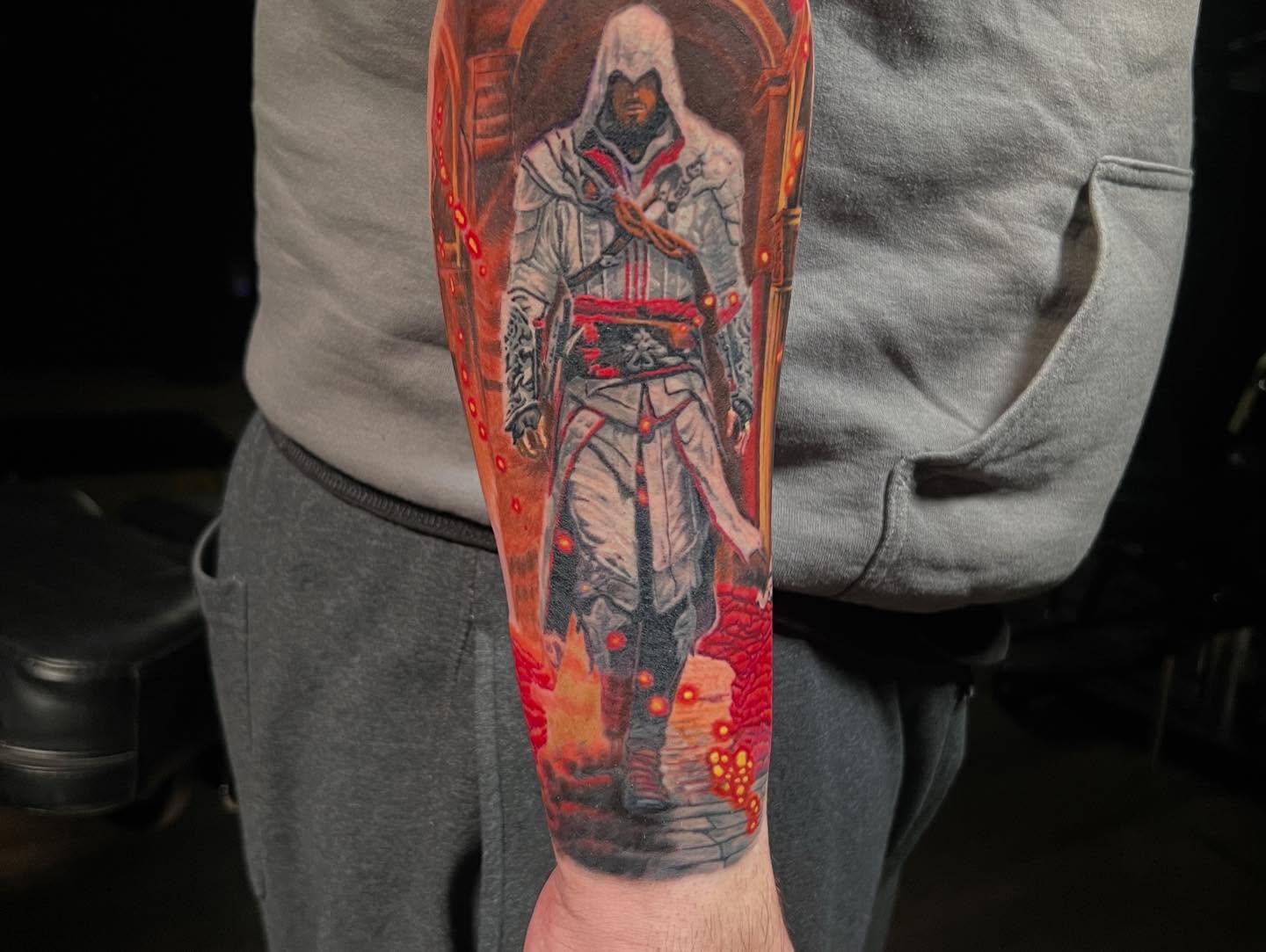 Assassin realism tattoo on the forearm by Lord Daniel Serna
