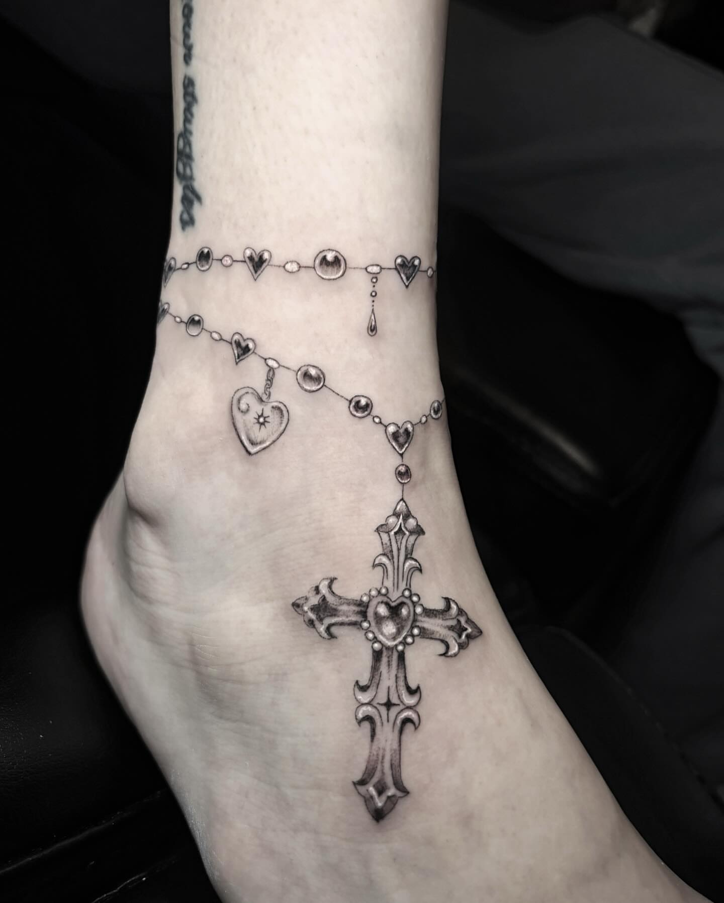 Cross and rosary black and grey tattoo on the foot by l i z ✶