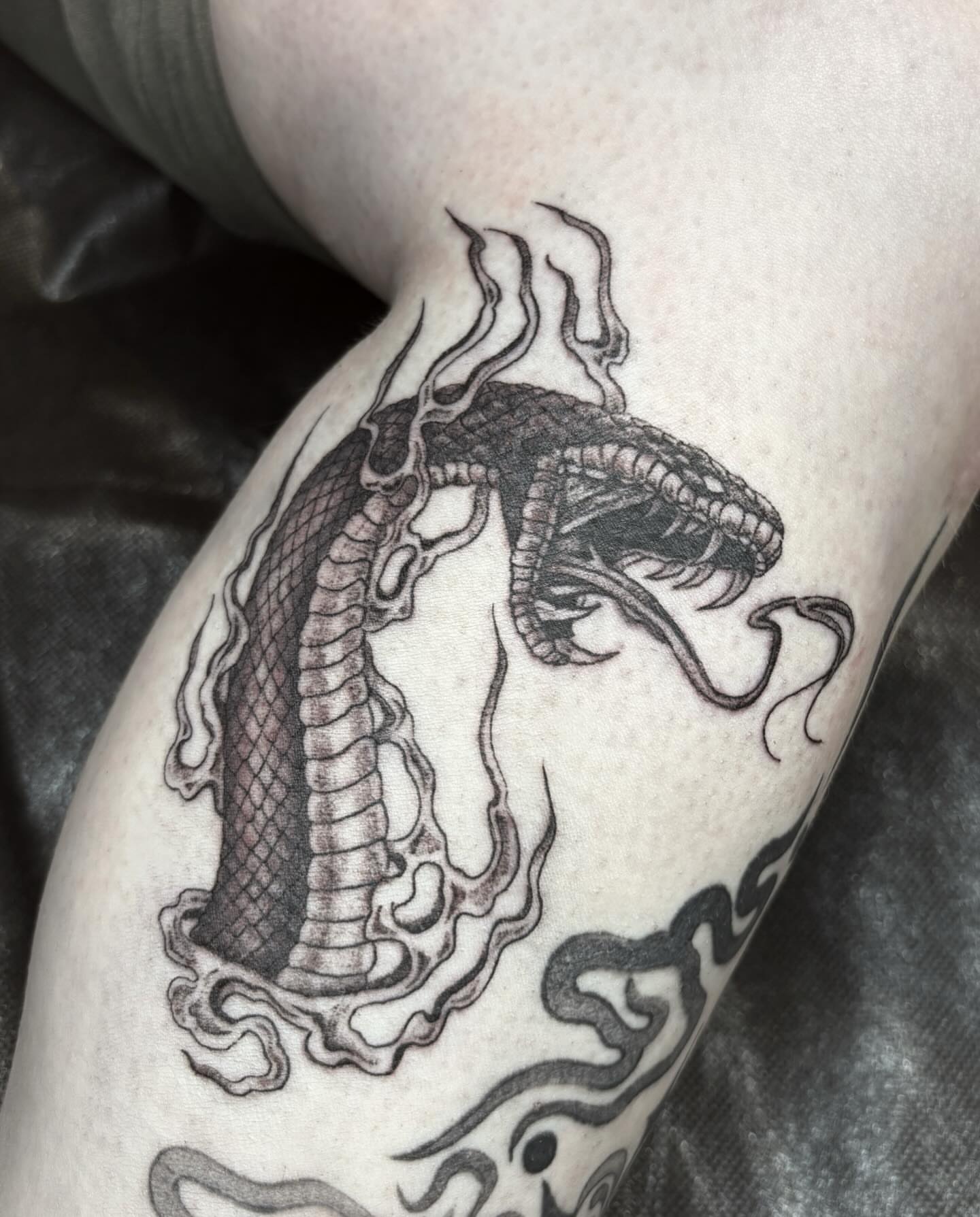 Dragon black and grey tattoo on the thigh by l i z ✶