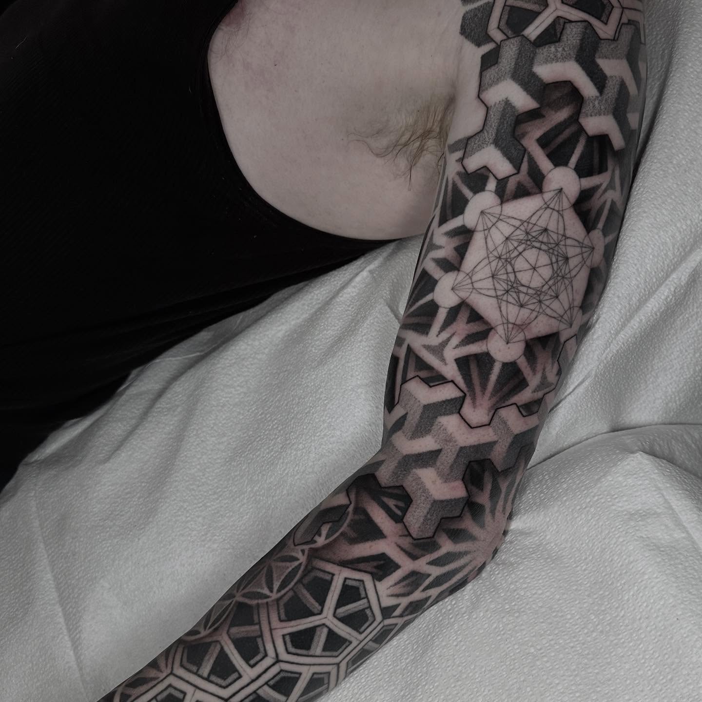 Geometric pattern geometric tattoo on the forearm by Kevin Johnson