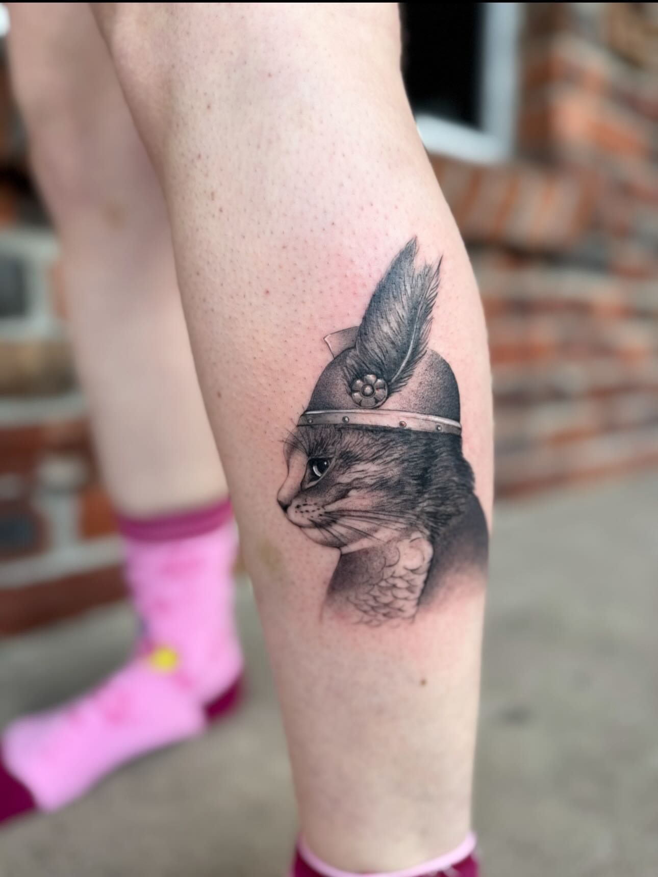 Cat wearing helmet realism tattoo on the forearm by Lily Cuoio~ Seattle