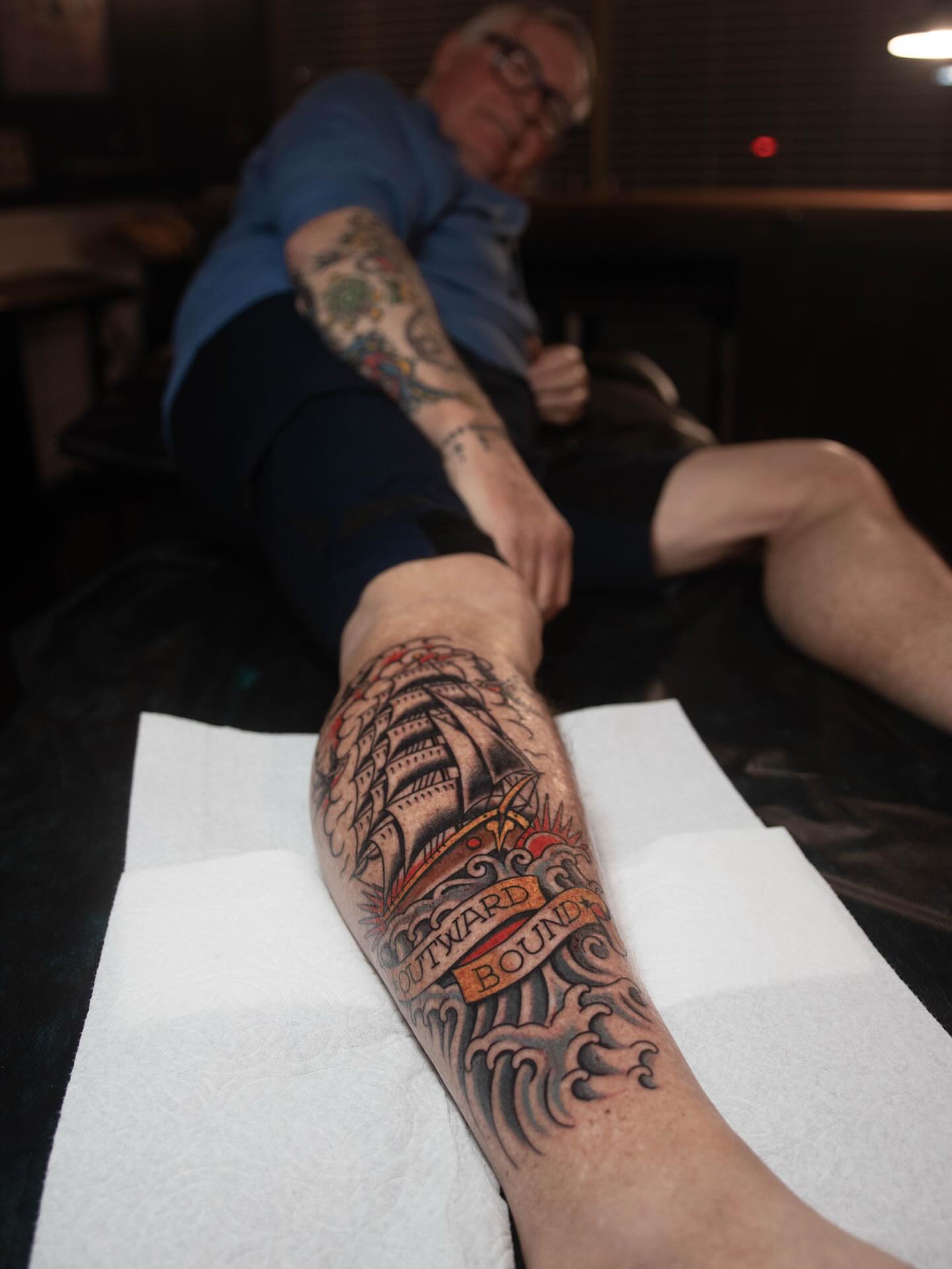 Ship and waves American traditional tattoo on the forearm by Danny Derrick, San Luis Obispo, California