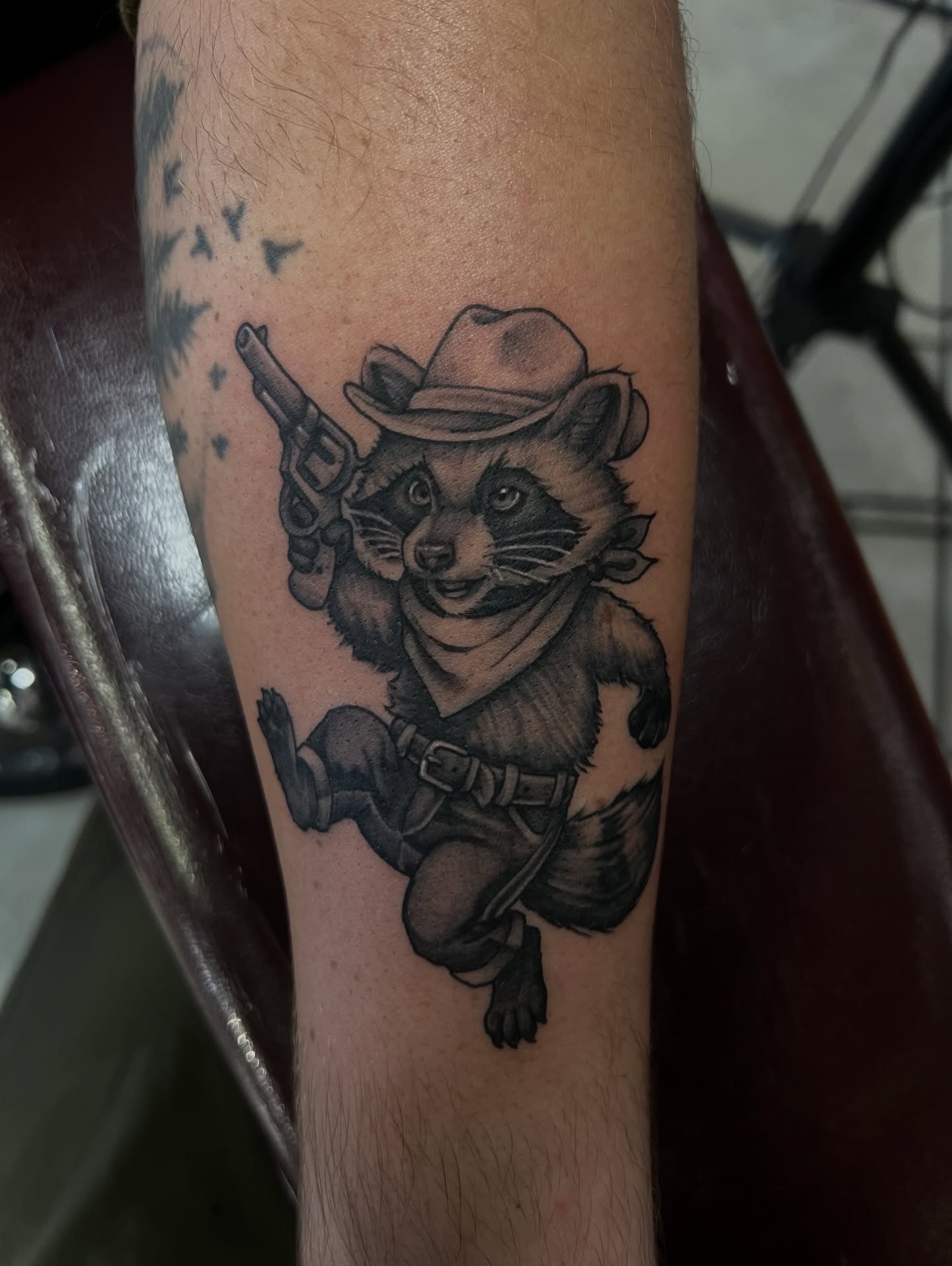 Raccoon cowboy black and grey tattoo on the forearm by M.zopfi - Tattoo Artist