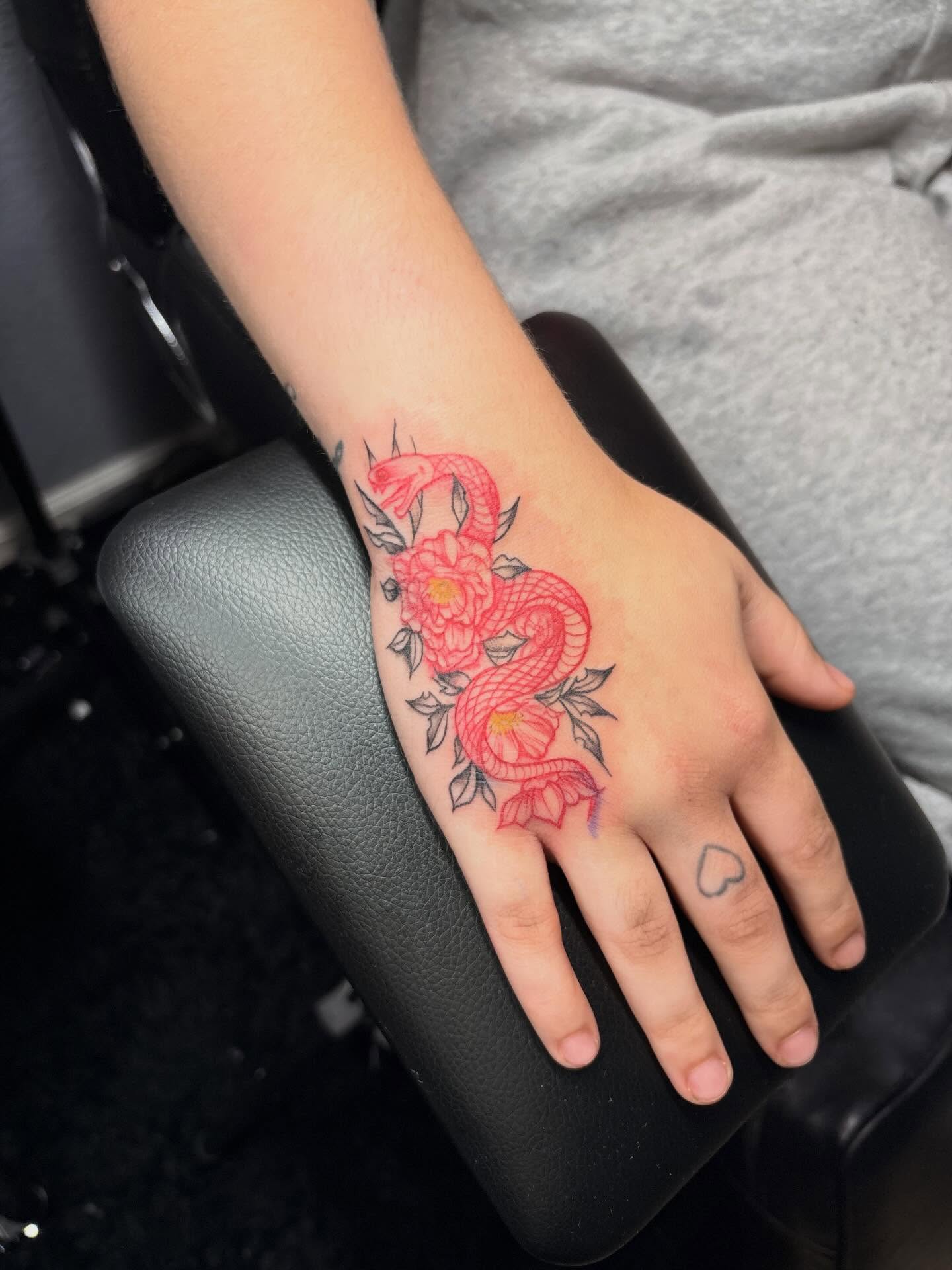 Snake and peony American traditional tattoo on the hand by Bay Area Tattoo Artist ✍🏽