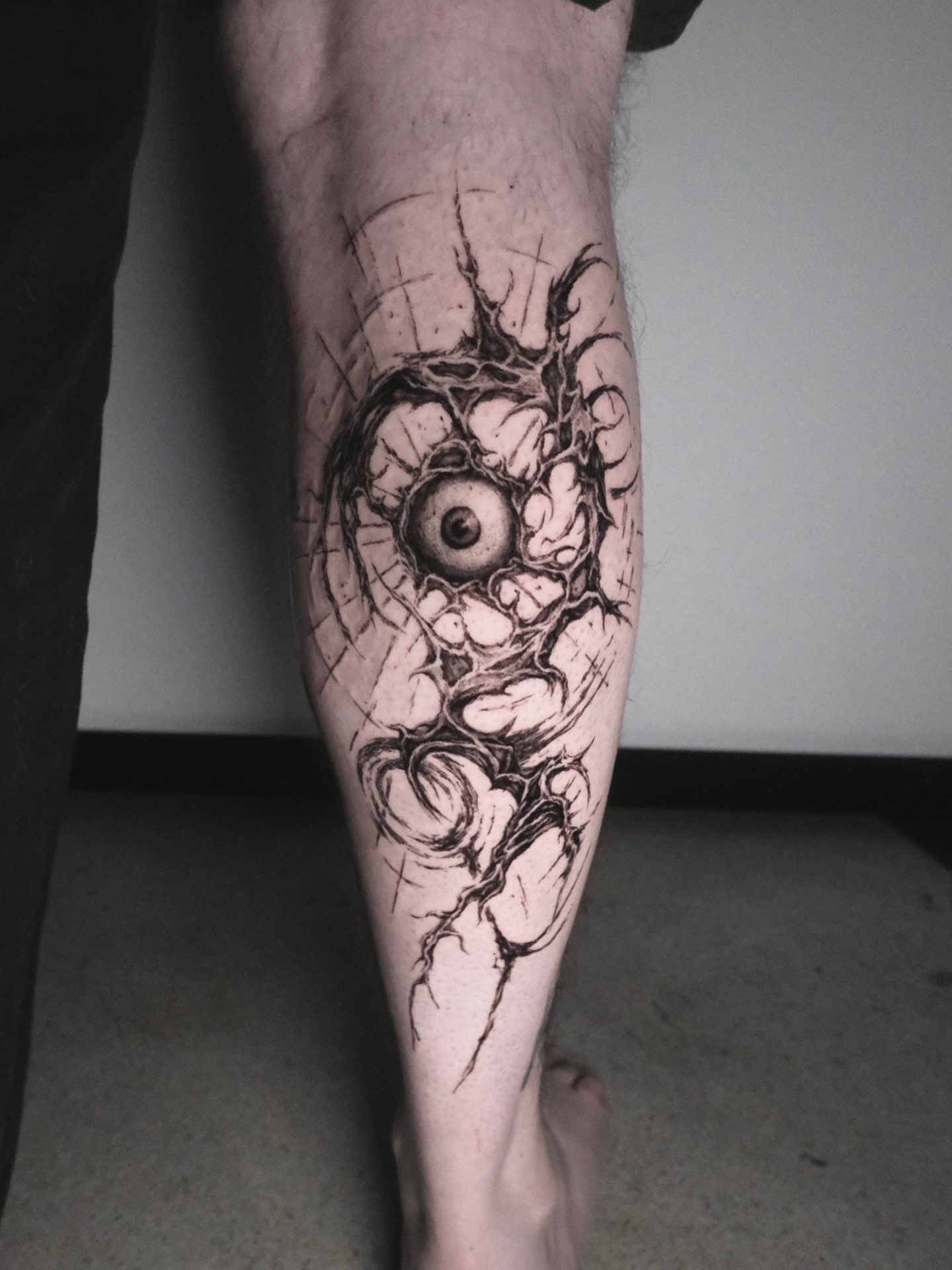 Eye dark realism tattoo on the calf by HanaKaki