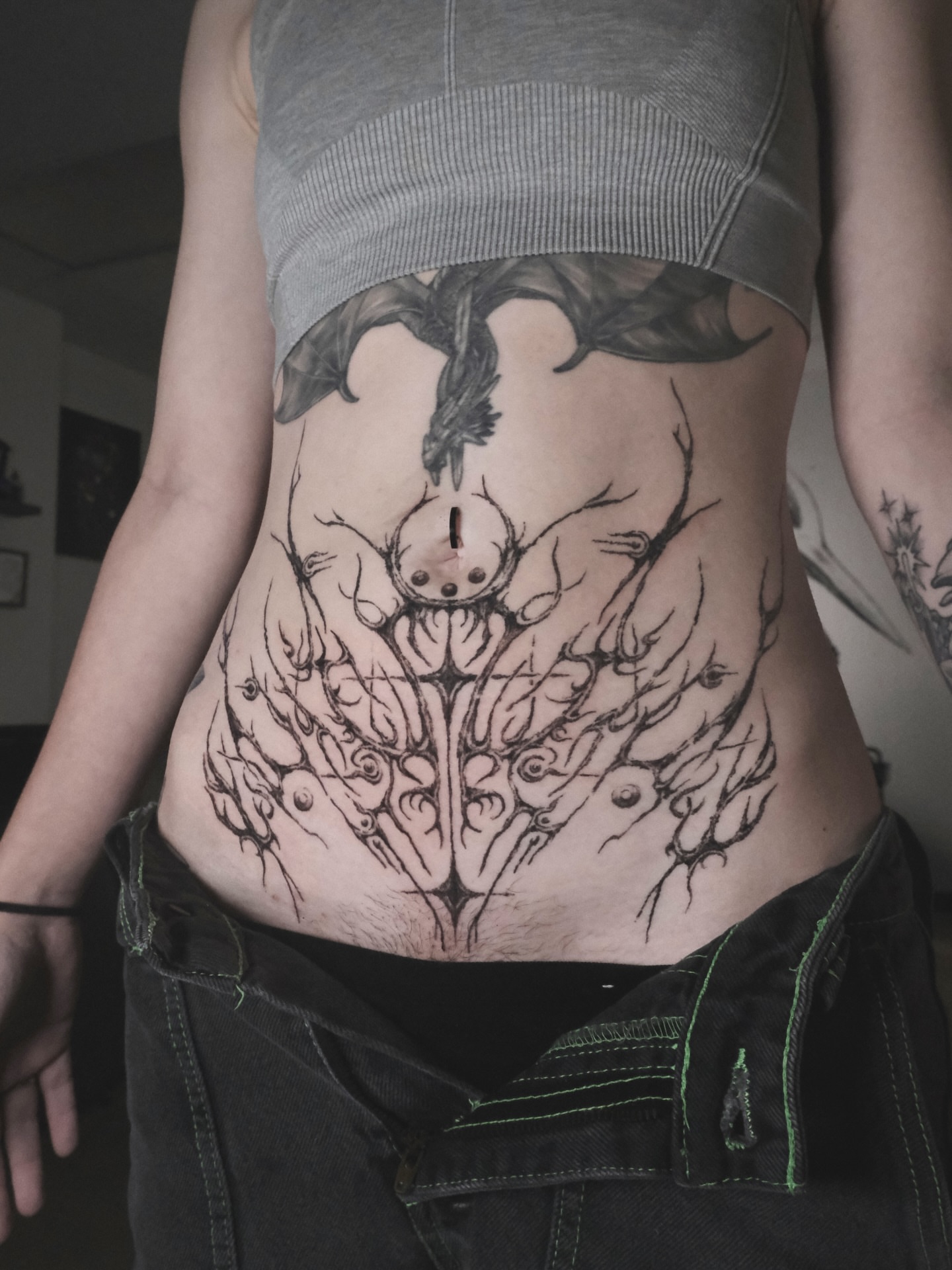 Abstract creature geometric tattoo on the torso by HanaKaki
