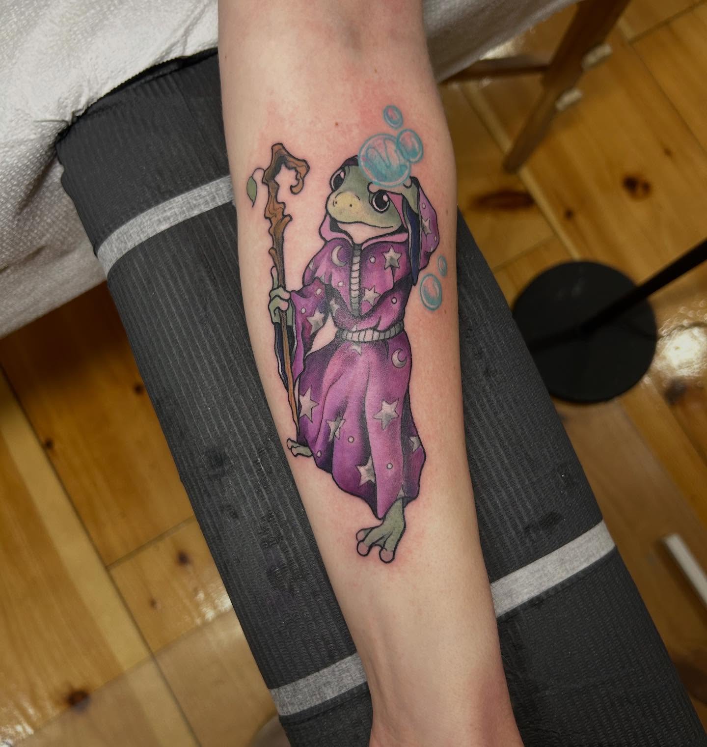 Frog wizard illustrative tattoo on the forearm by 𝓗𝓪𝔂𝓵𝓮𝔂 𝓢𝓪𝓿𝓪𝓰𝓮