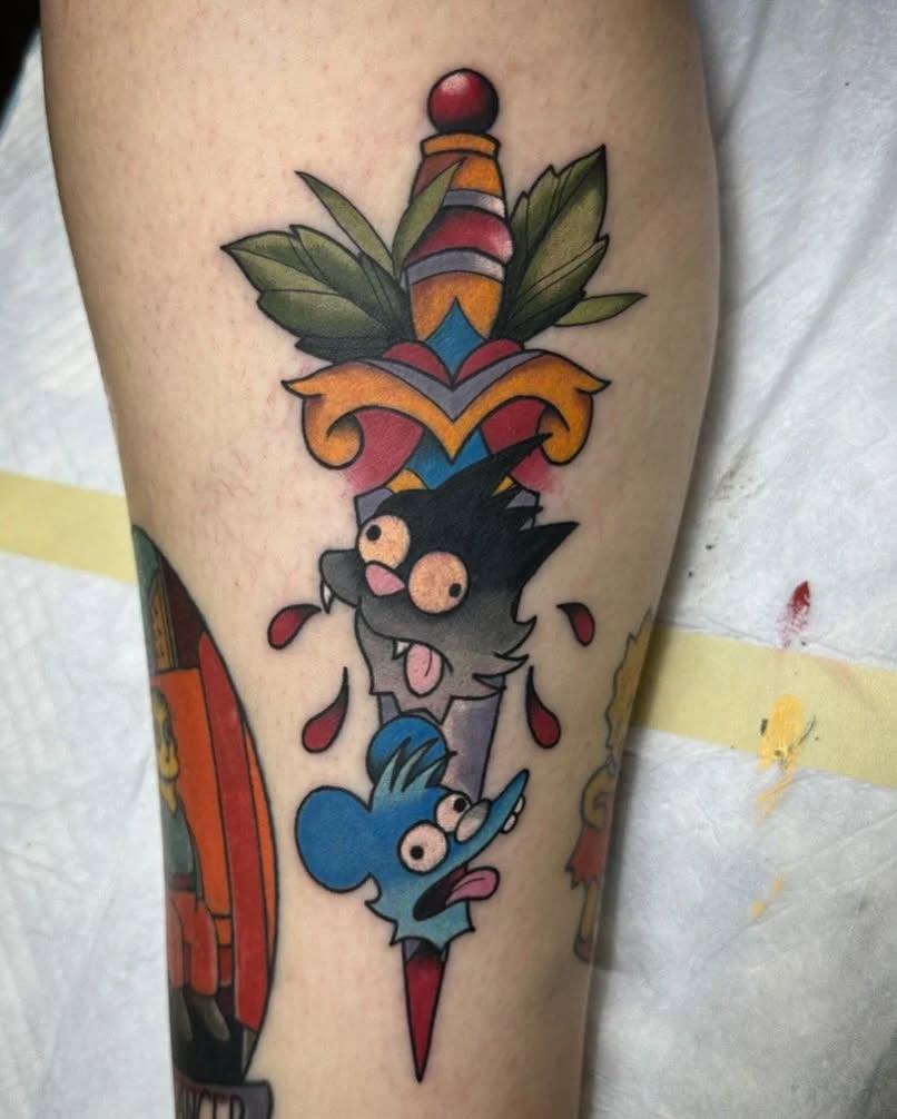 Dagger with cat and mouse characters American traditional tattoo on the forearm by Rafael Lubowitz