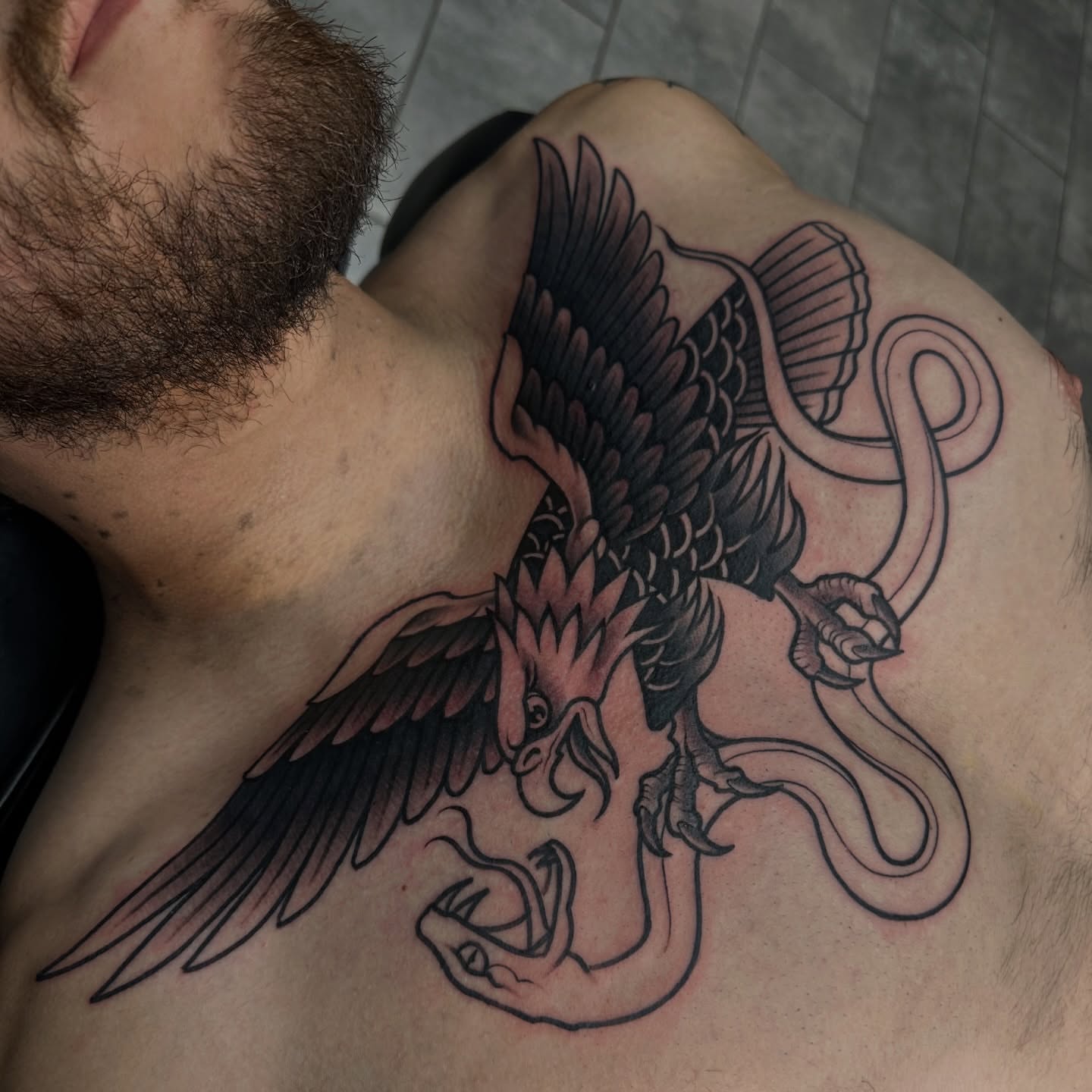 Phoenix black and grey tattoo on the chest by Ryan K Severe