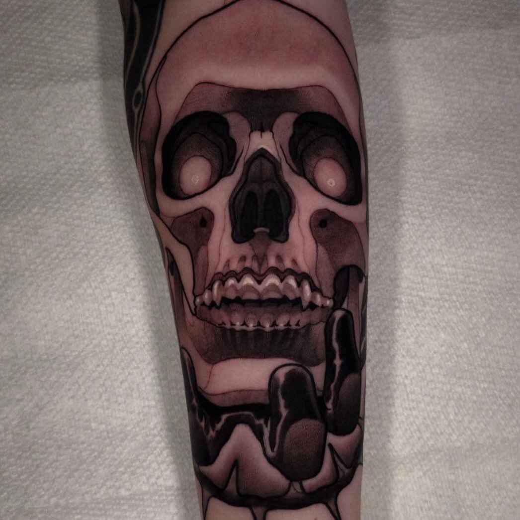 Skull realism tattoo on the forearm by Nathan Thomas