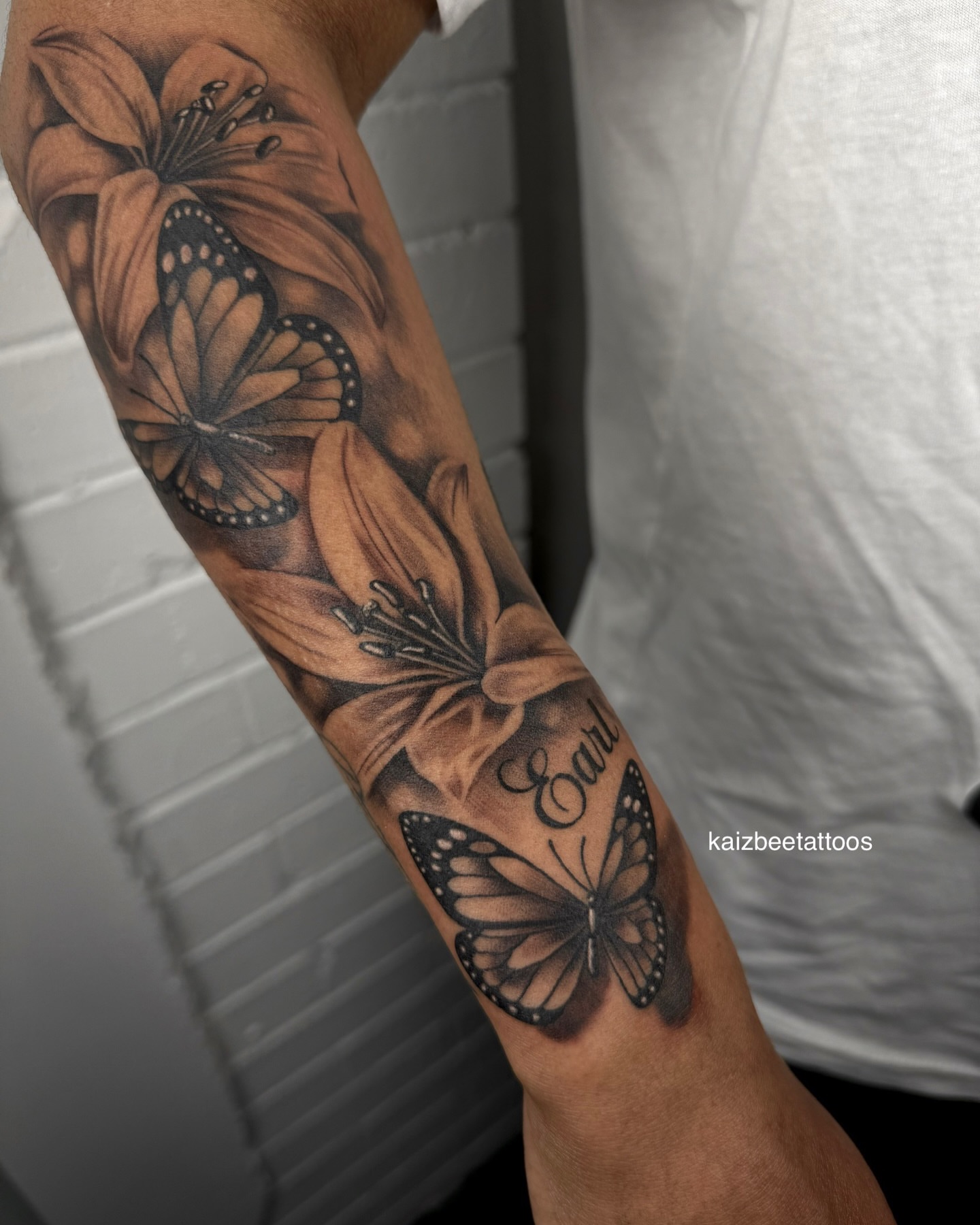Tattoo by @kaizbeetattoos — realism, black_and_grey