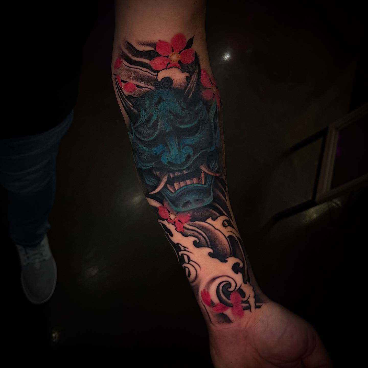 Mask with cherry blossoms japanese irezumi tattoo on the forearm by Smuk One
