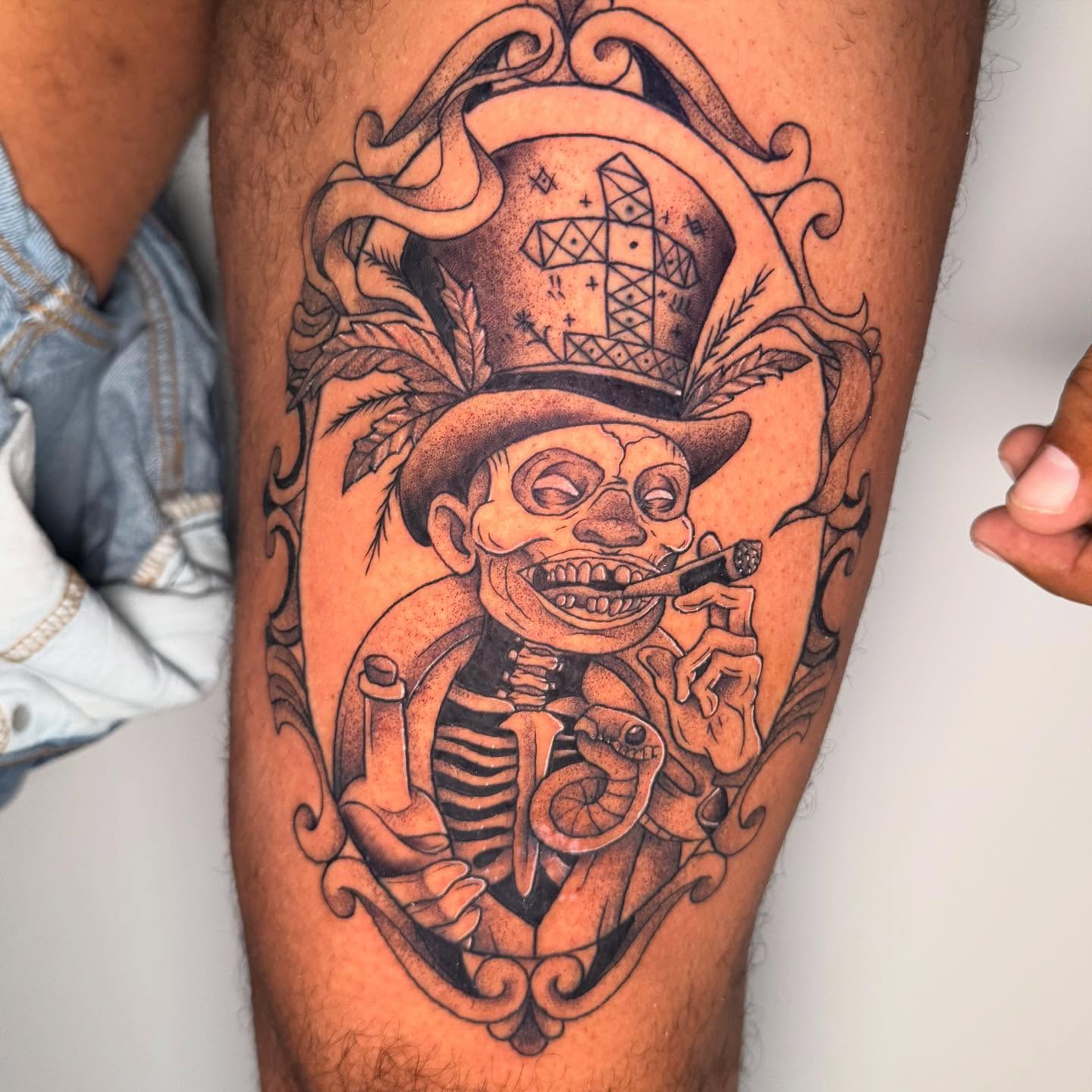 Skeleton smoking cigar American traditional tattoo on the thigh by Felicity