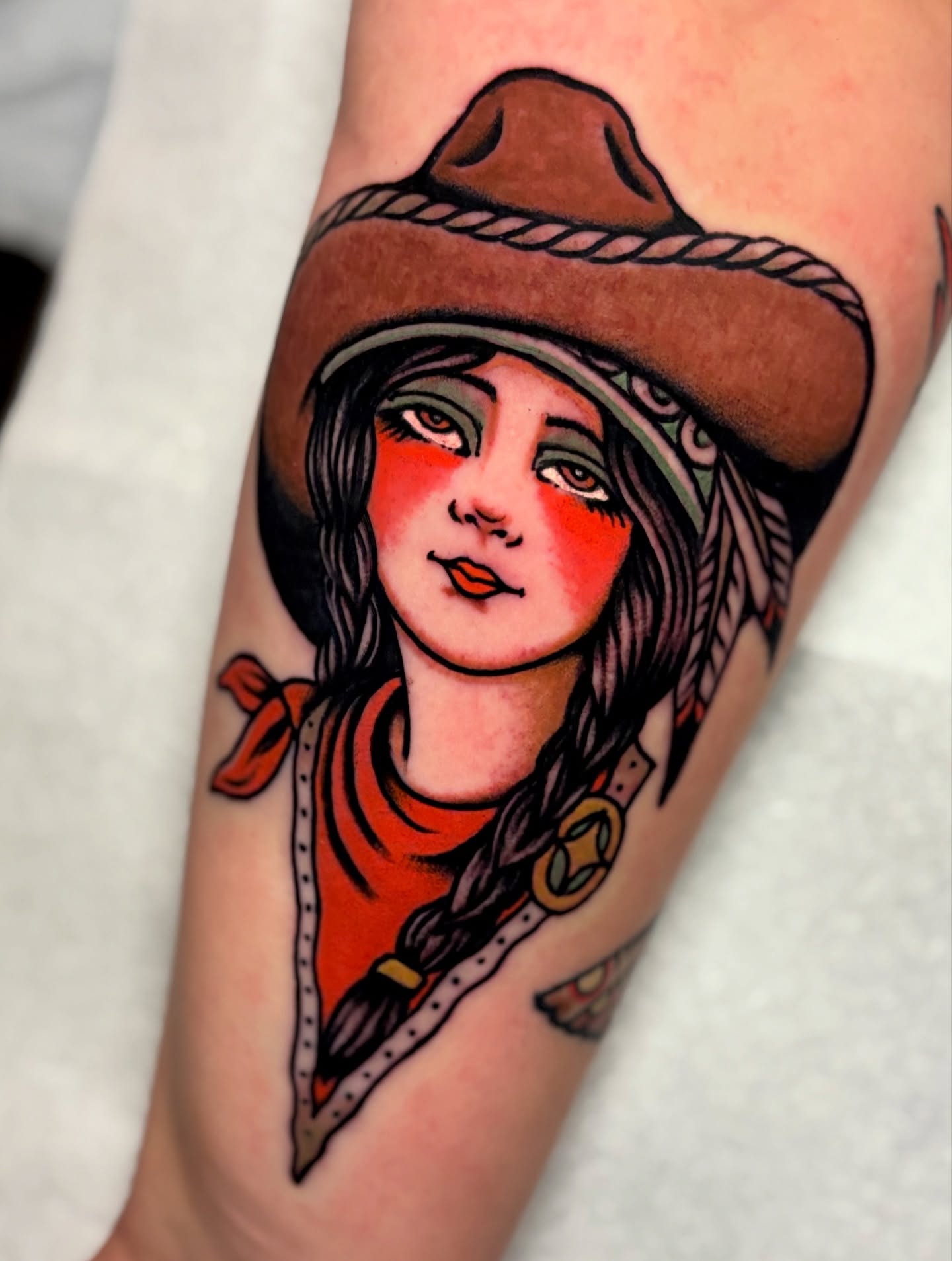 Cowgirl portrait American traditional tattoo on the forearm by Weston Imhoff