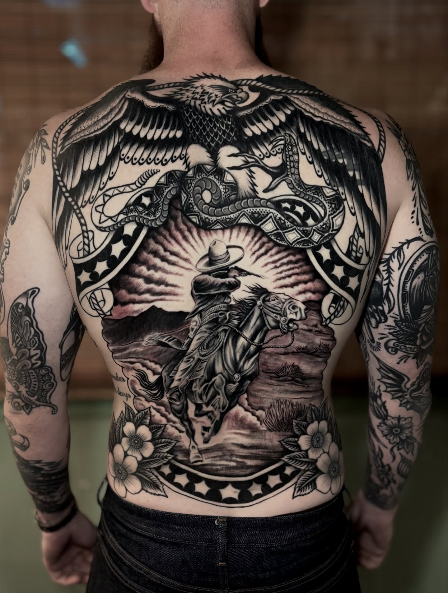 Cowboy riding horse American traditional tattoo on the back by Weston Imhoff