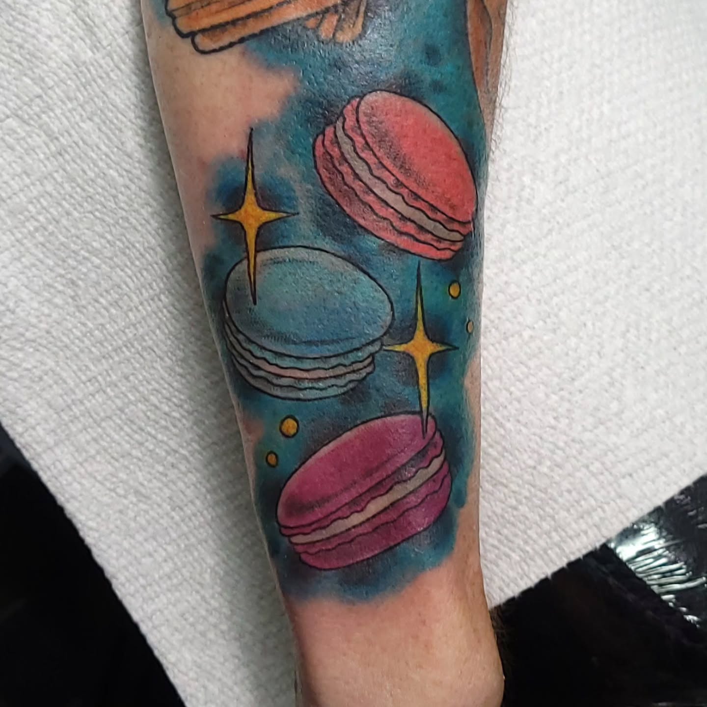 Macarons illustrative tattoo on the forearm by Austin Berry