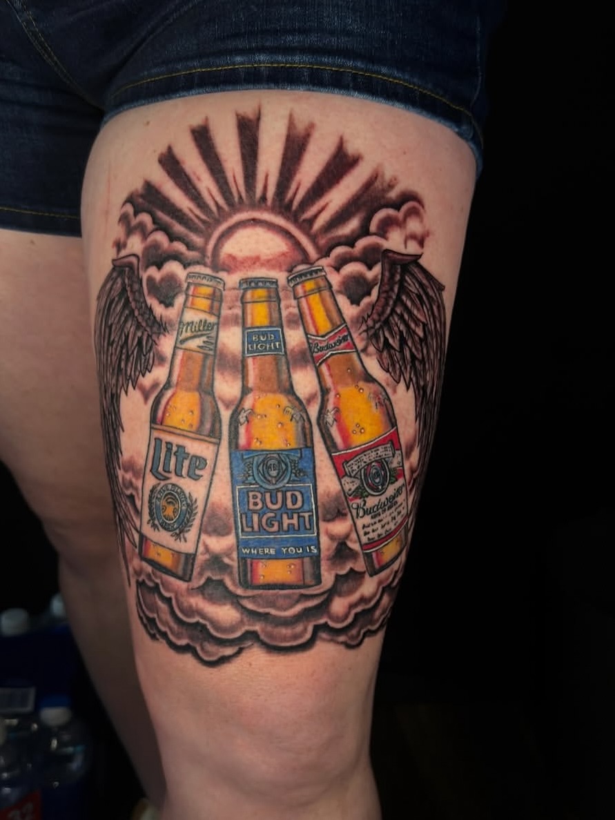 Beer bottles realism tattoo on the thigh by Gary Chase