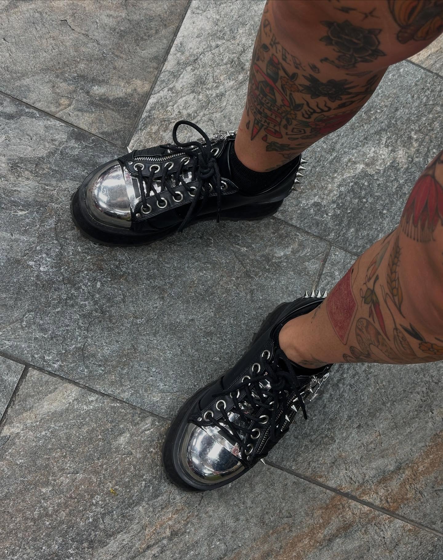 Tattooed leg black and grey tattoo on the leg by Olivia Norbert
