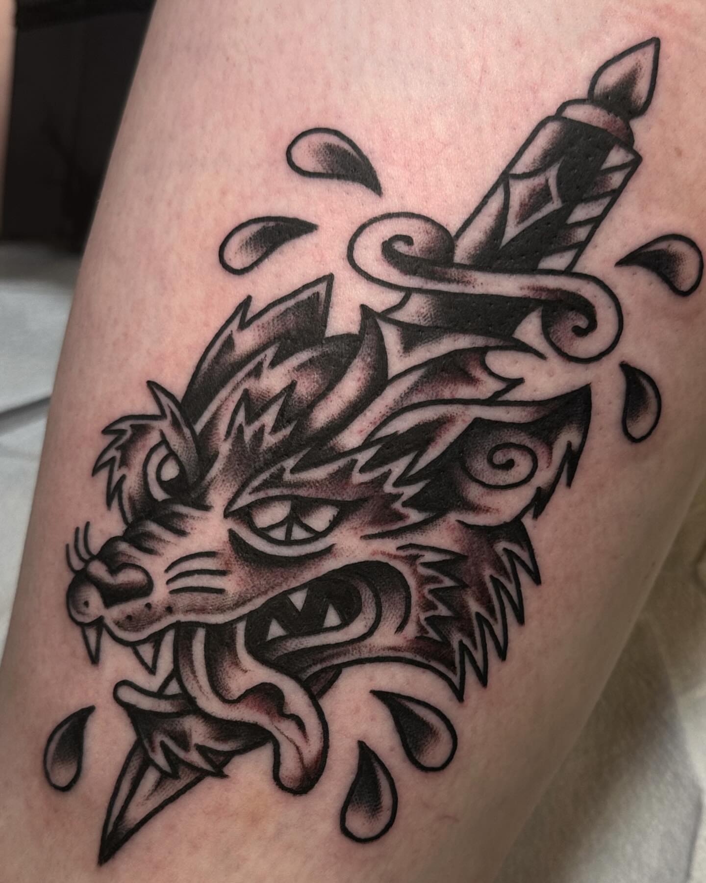 Wolf head with dagger American traditional tattoo on the forearm by ࿊ Emma Sloan Tattoos ࿊, Austin, Texas