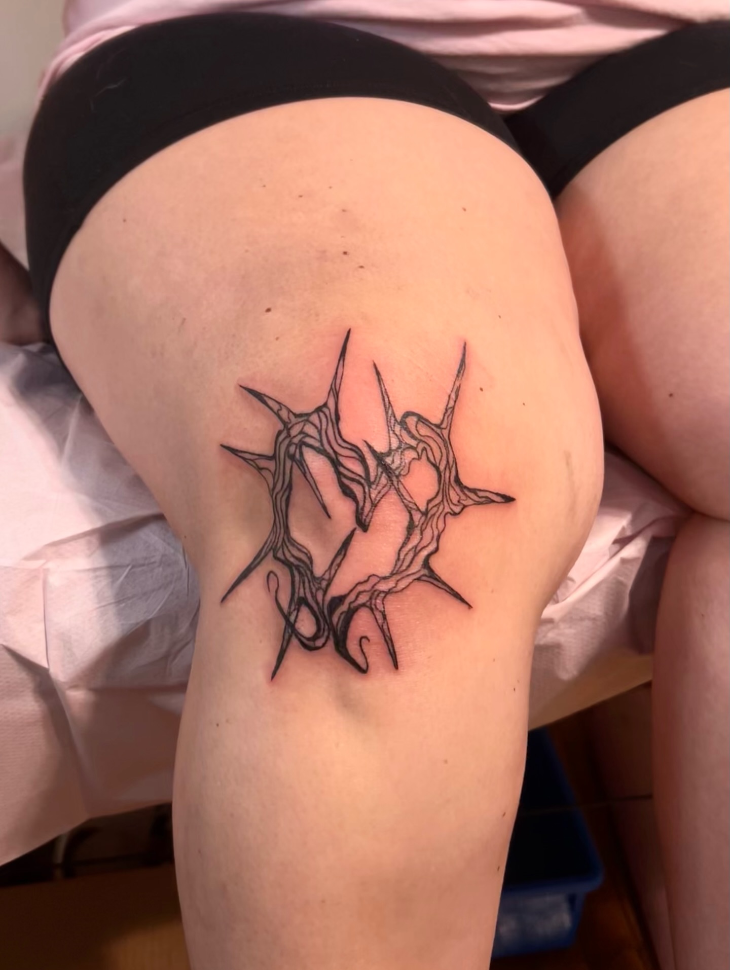 Thorn crown black and grey tattoo on the thigh by Sarah