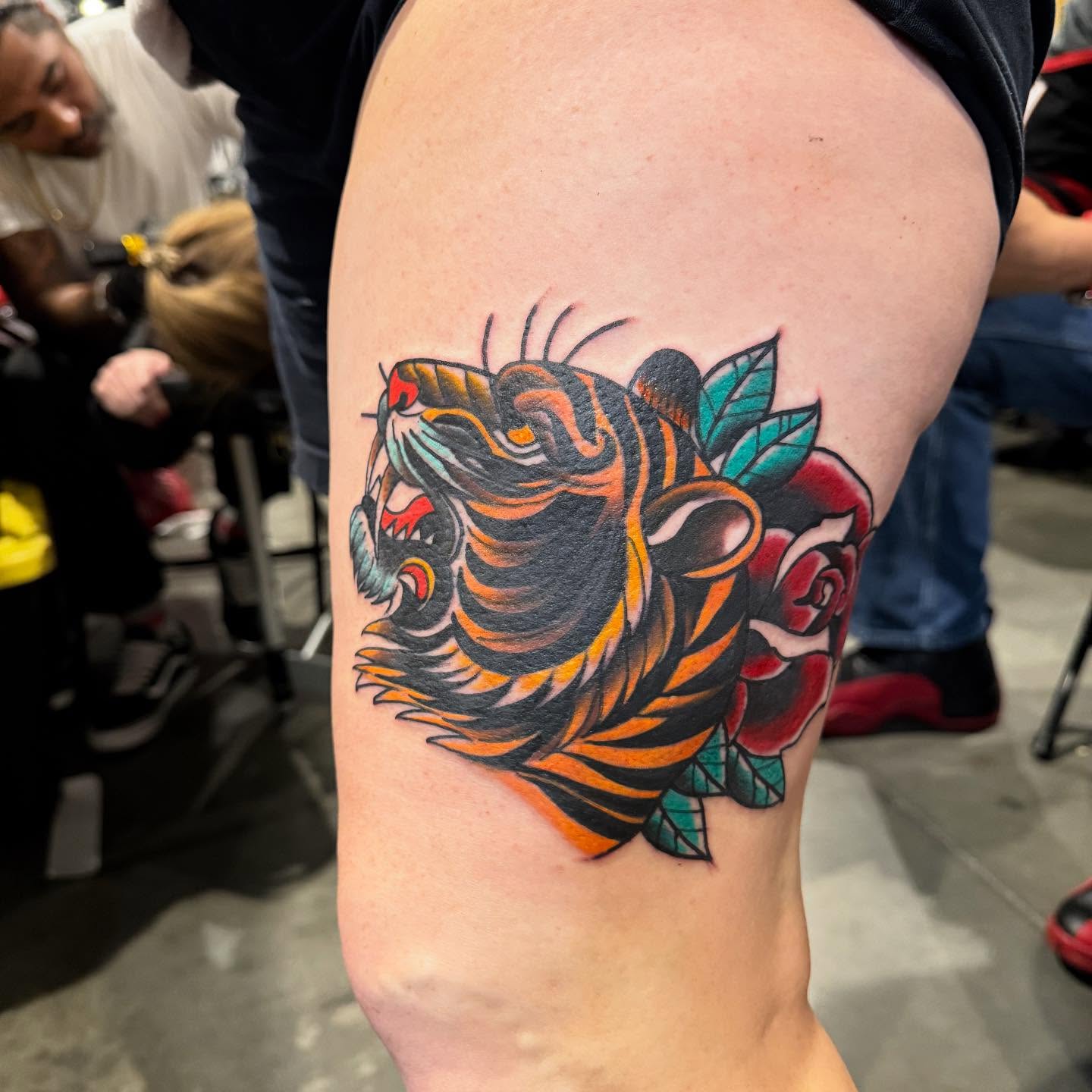 Tiger head American traditional tattoo on the thigh by Randall Croley El