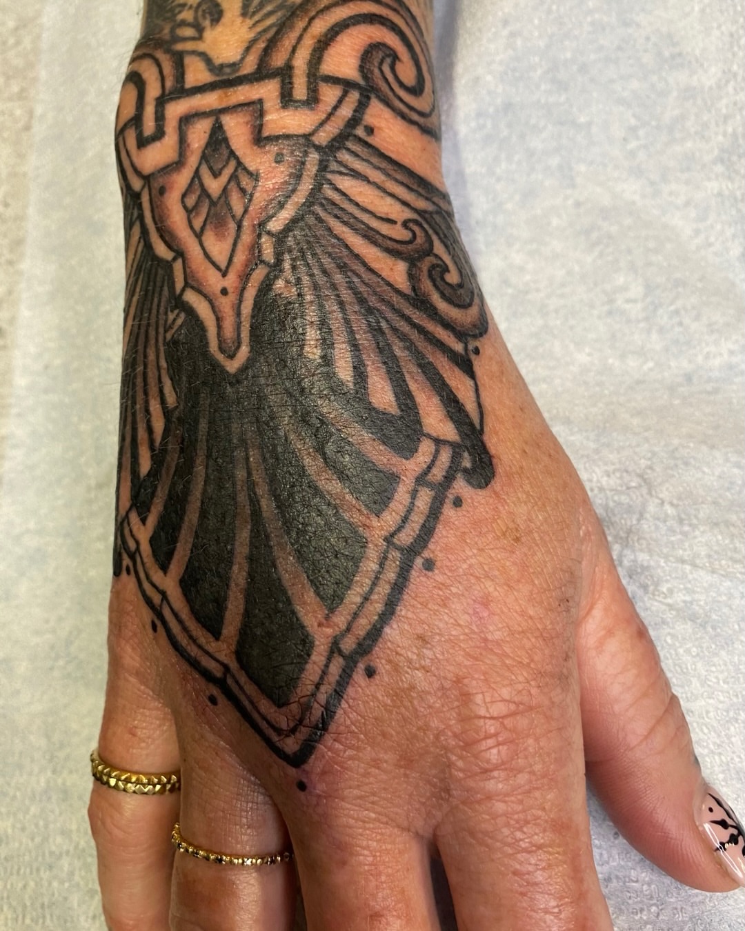 Gothic shield geometric tattoo on the hand by Dave Rodriguez