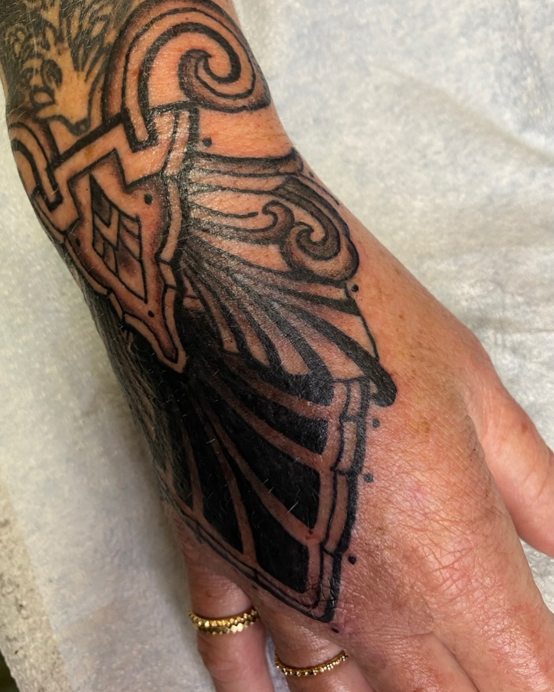 Abstract design geometric tattoo on the forearm by Dave Rodriguez