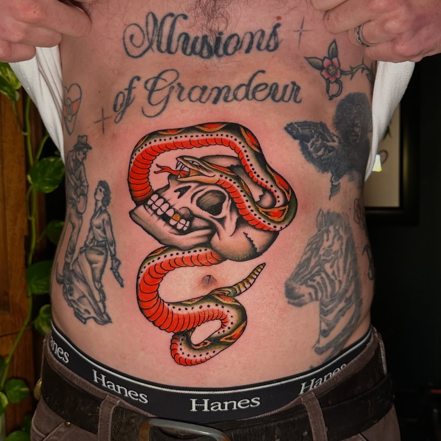Snake and skull American traditional tattoo on the torso by Max Peterson