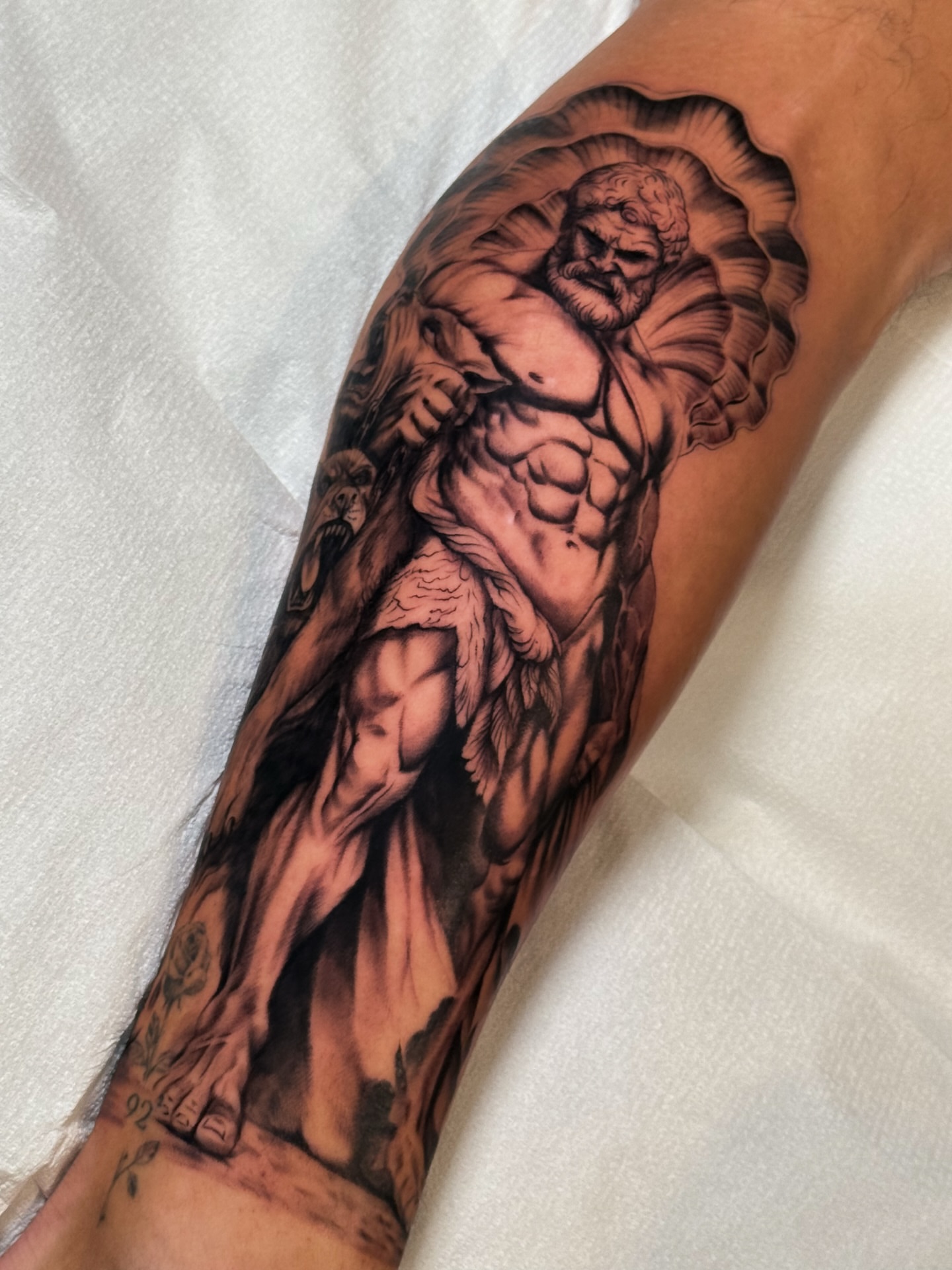 Muscular god realism tattoo on the forearm by Iryna Polyakhova