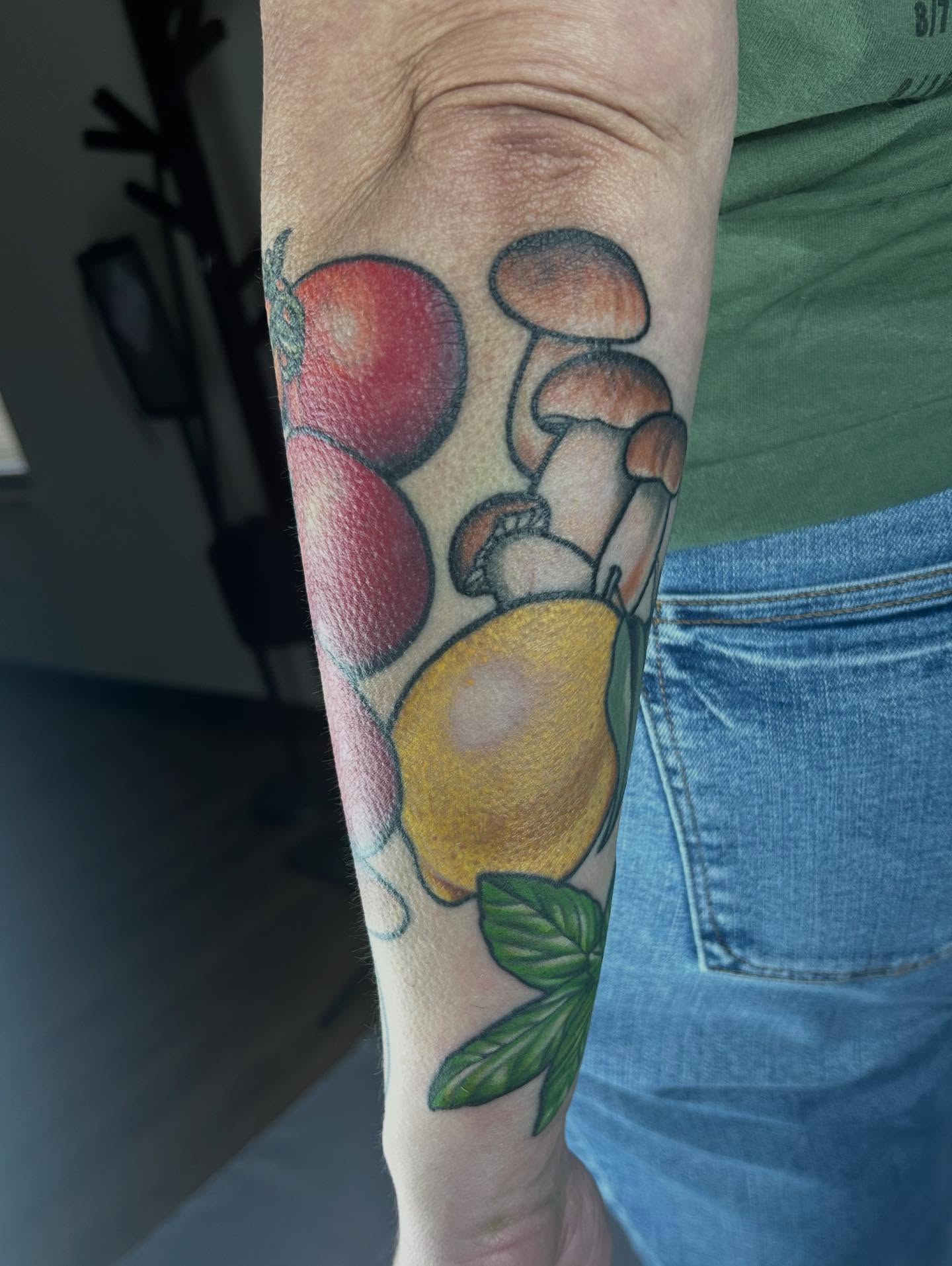 Fruit and mushrooms realism tattoo on the forearm by Mary Rose Heckle
