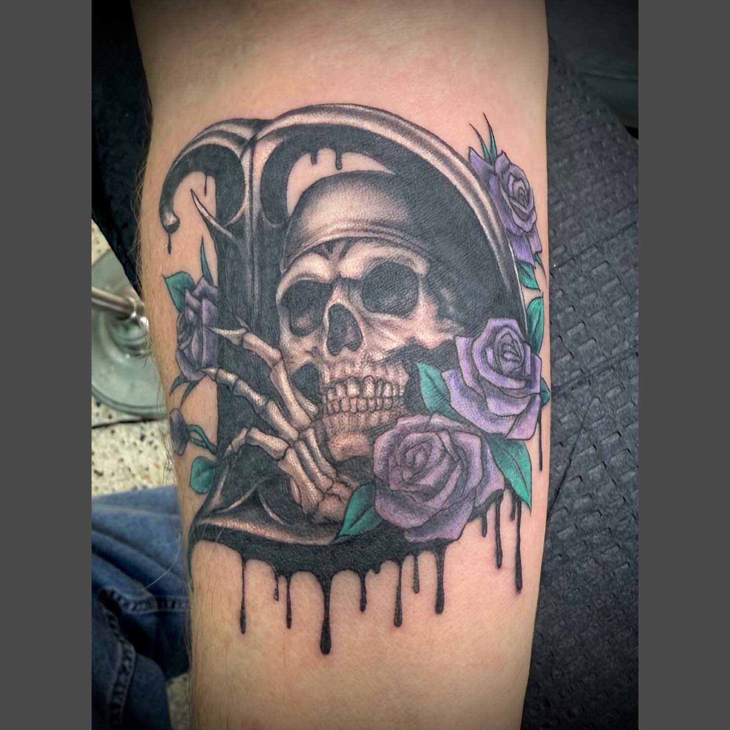 Skull with roses realism tattoo on the forearm by Richard Nagy, New Orleans, Louisiana