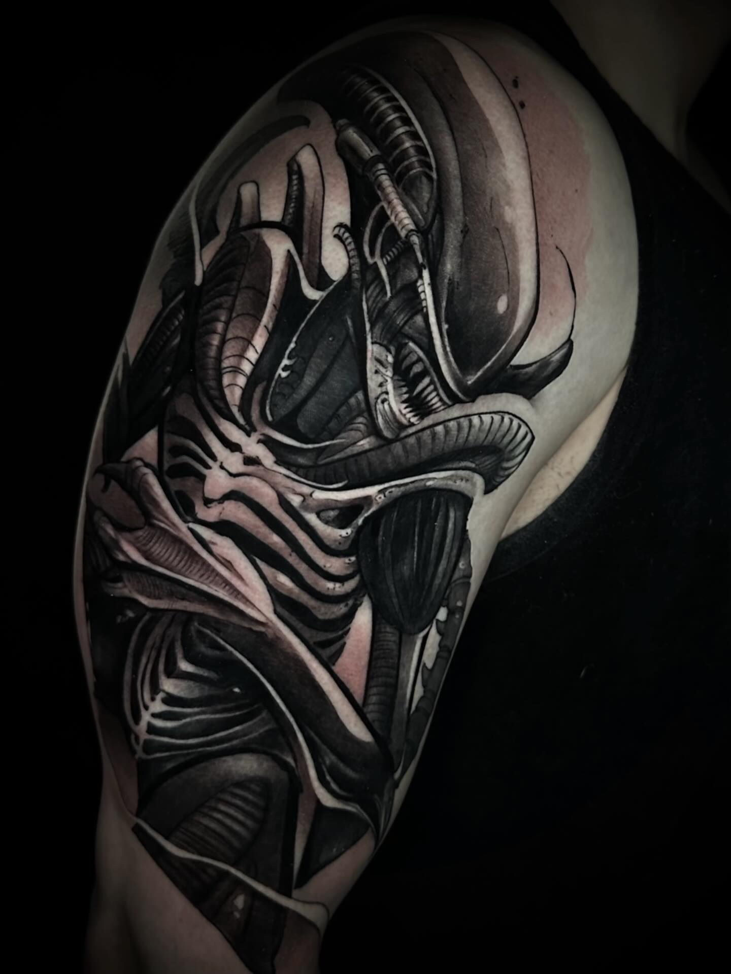 Alien xenomorph realism tattoo on the shoulder by Nathan Adsit