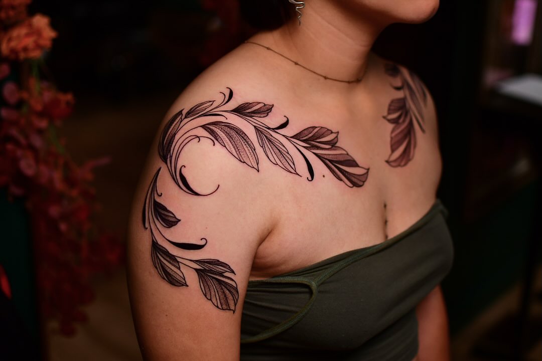 Feather black and grey tattoo on the shoulder by Karina πΌ Orange County Tattoo Artist