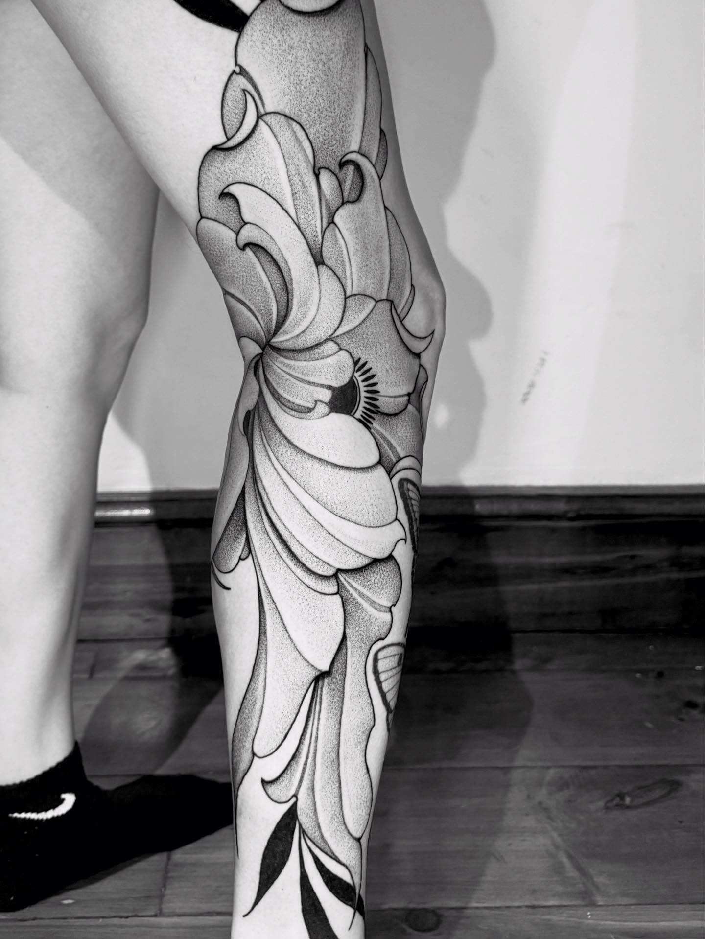 Lotus flower dotwork tattoo on the calf by Lauren Llerandi
