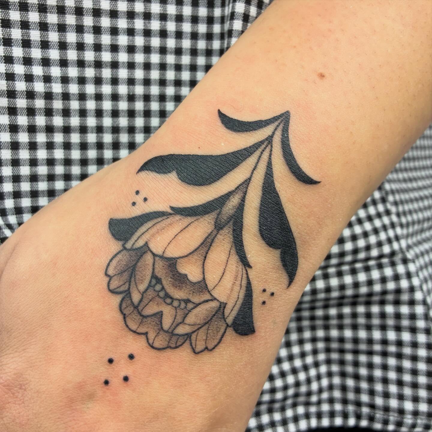 Skull with floral elements dotwork tattoo on the forearm by ⊹ Avery Peterson ⊹