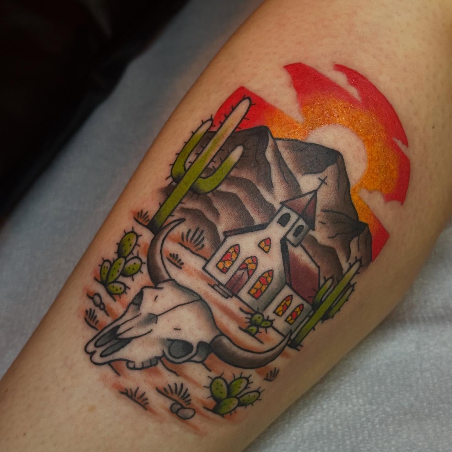Desert landscape American traditional tattoo on the forearm by Zach Gonzalez, Austin, Texas