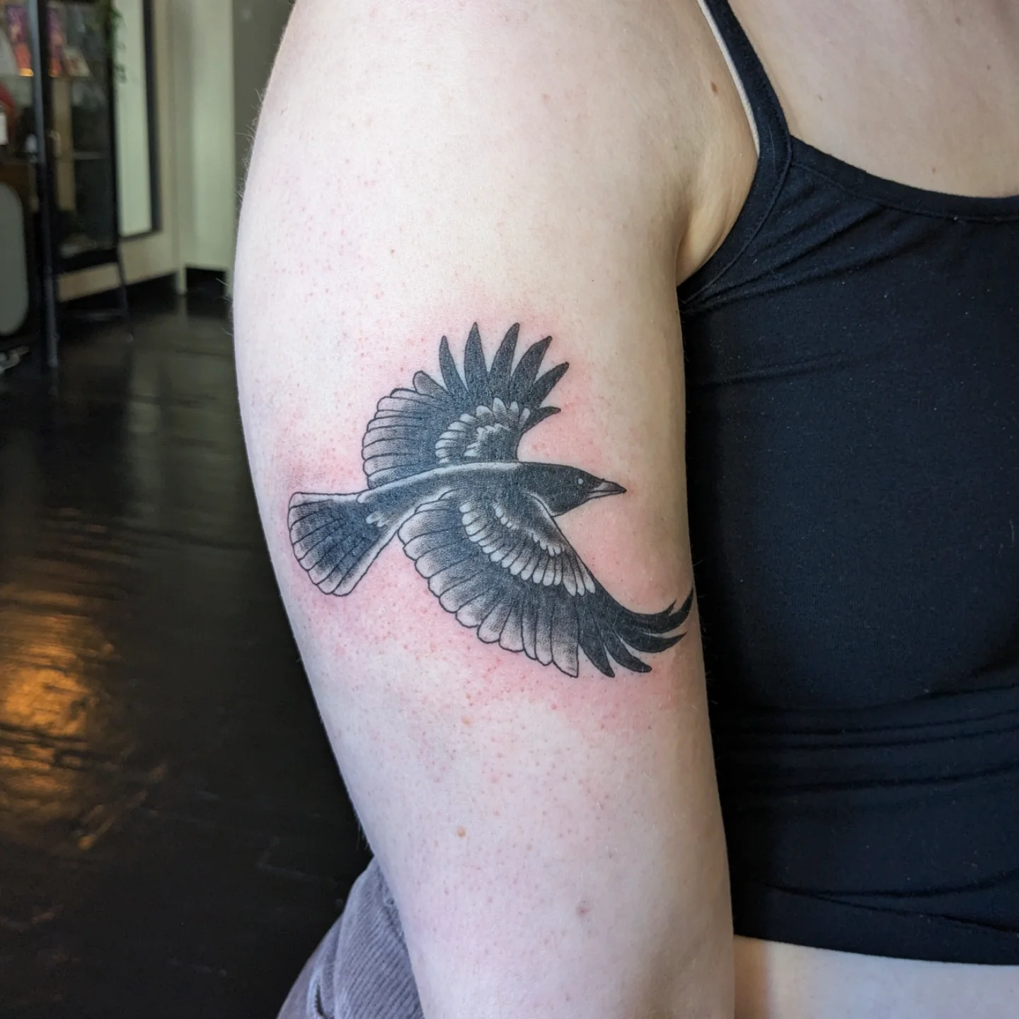Bird black and grey tattoo on the upper arm by Madison Cañedo ✺ Portland tattoo