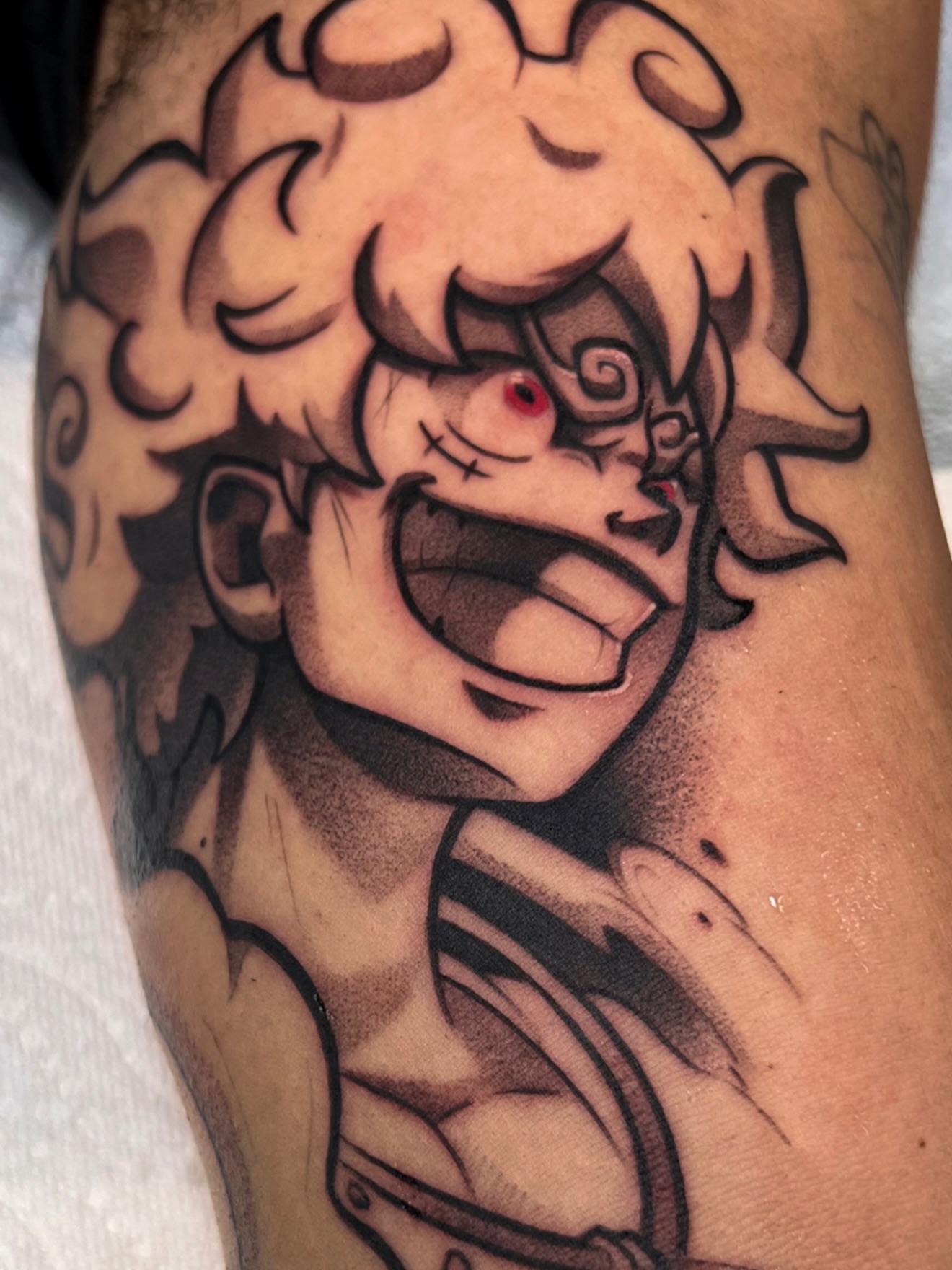 Anime character anime tattoo on the forearm by Jake lyon