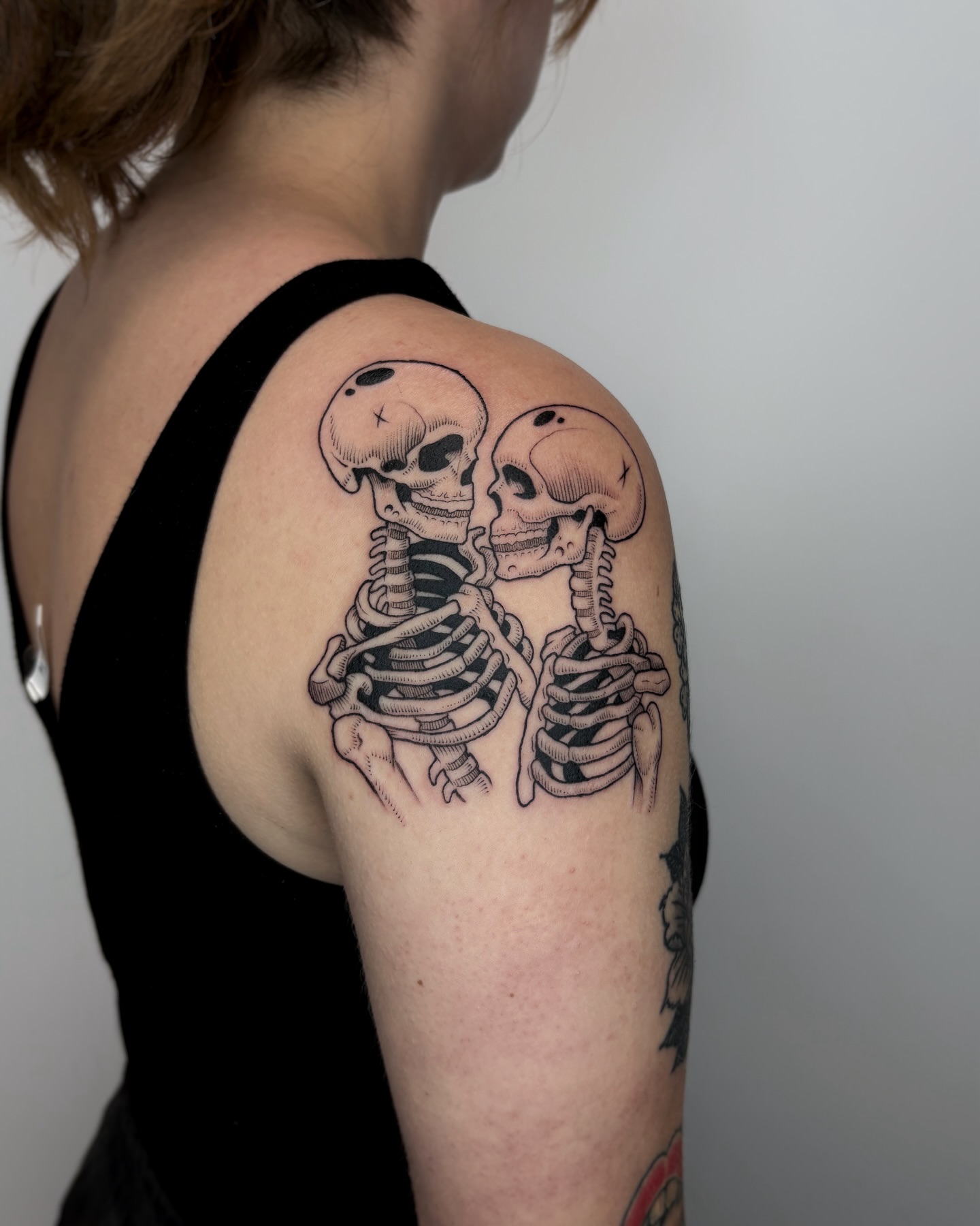 Skeletons black and grey tattoo on the shoulder by Kuya, Berkeley, California