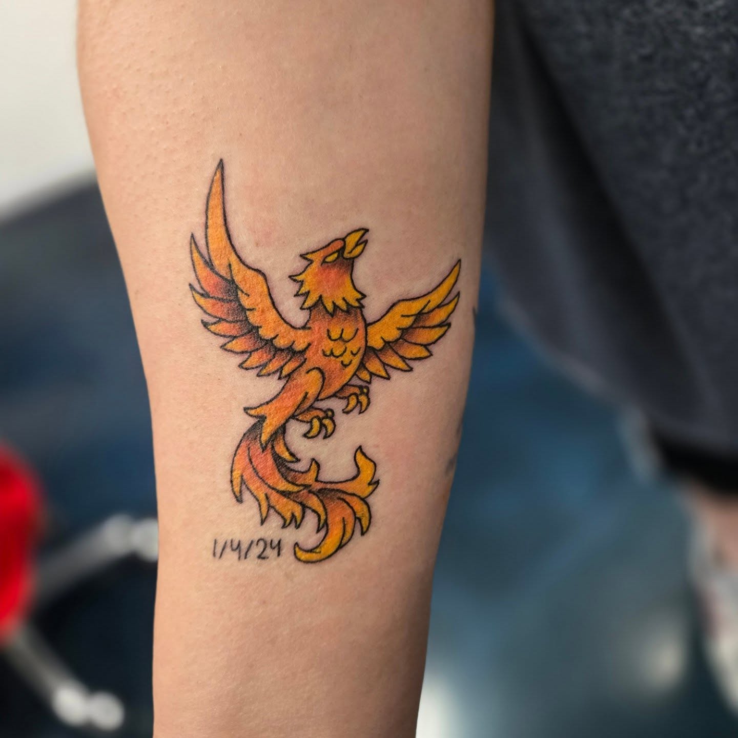Phoenix neo-traditional tattoo on the forearm by Matt Page