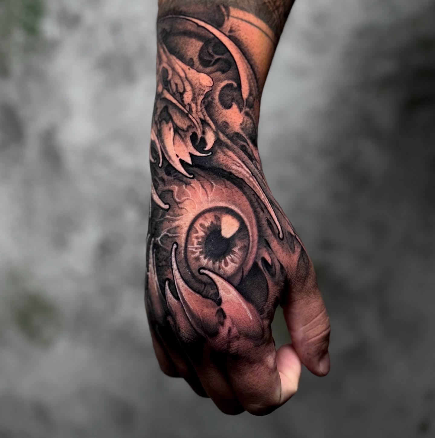 Eye and flame realism tattoo on the hand by James Hall