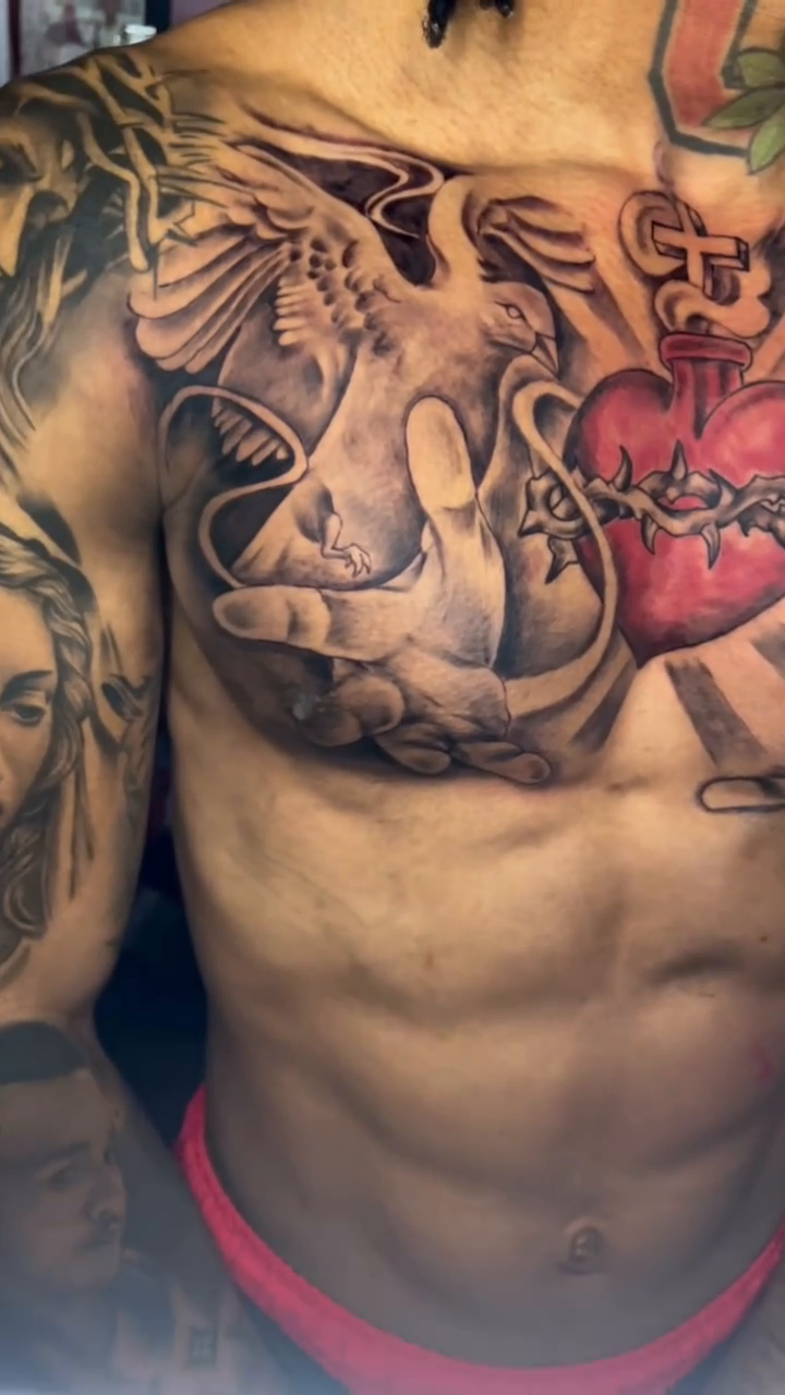 Chicano tattoo on the chest by Inkman Parson
