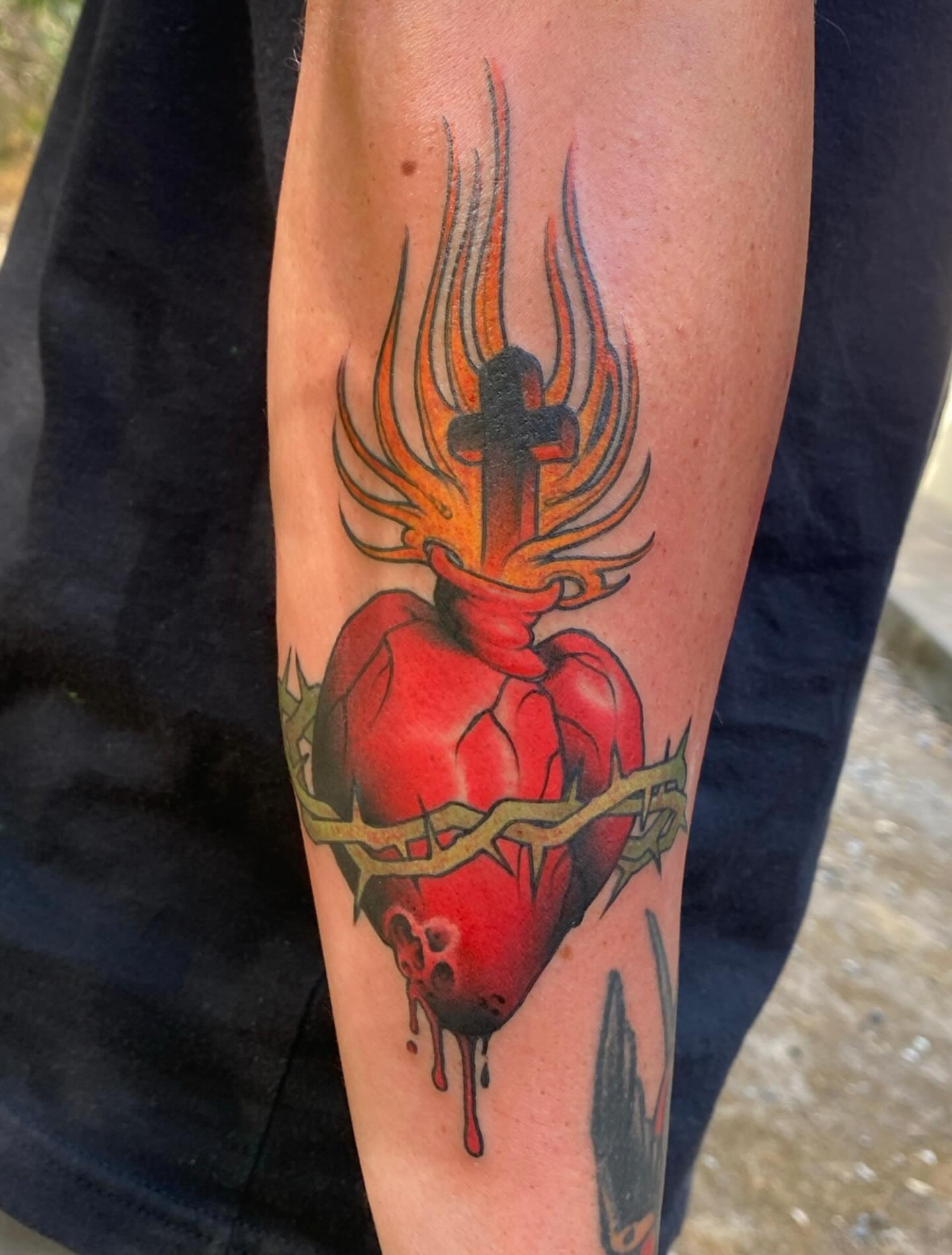 Heart with flames neo-traditional tattoo on the forearm by Kyle Kozek, Columbus, Ohio